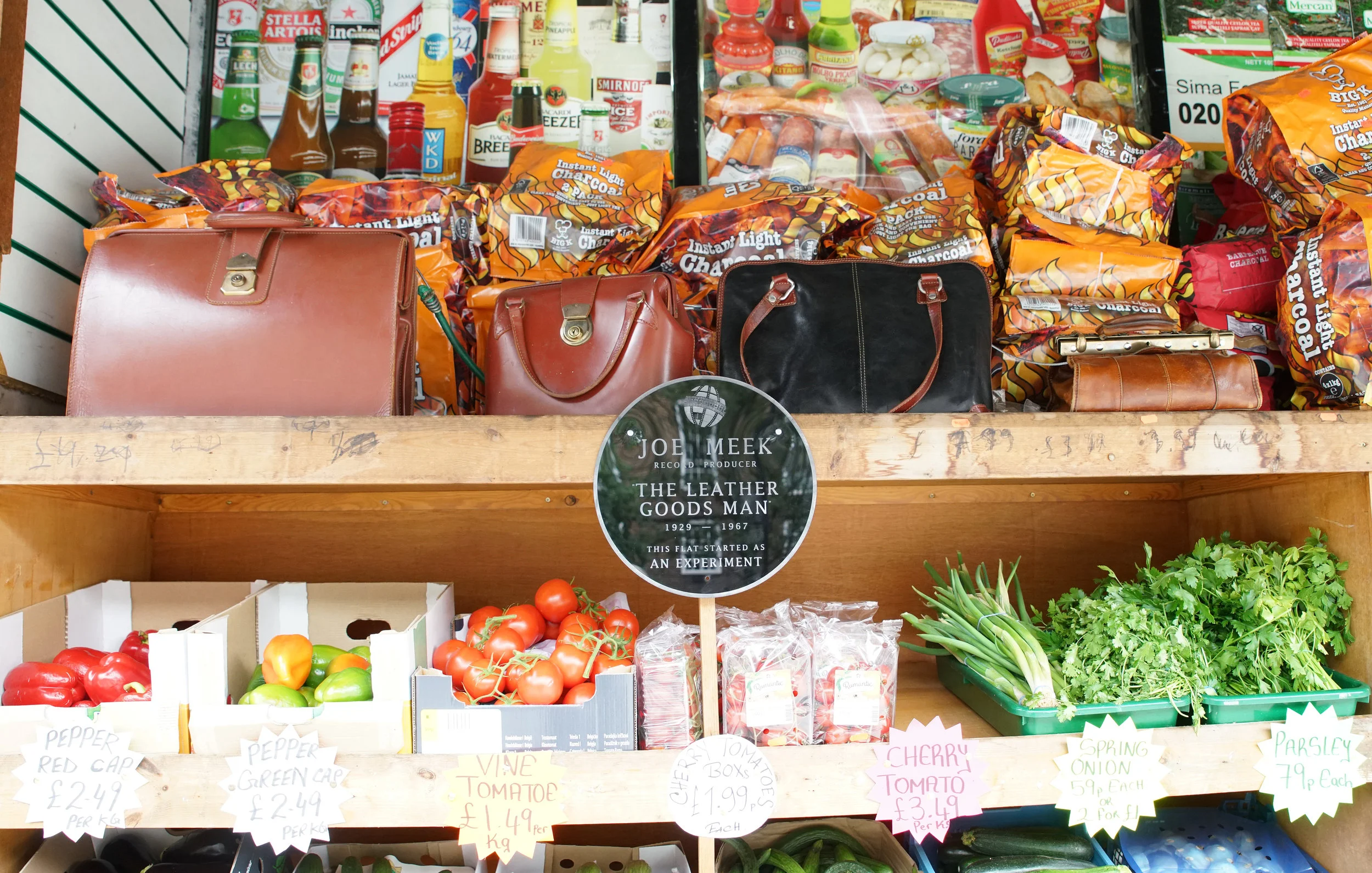 Leather goods installed among the wares of Holloway Express 24 hour supermarket at 304 Holloway Road. The leather goods contained speakers playing sounds as would have been heard through the floor of the leather goods shop located below Joe Meek's independent home recording studio. 