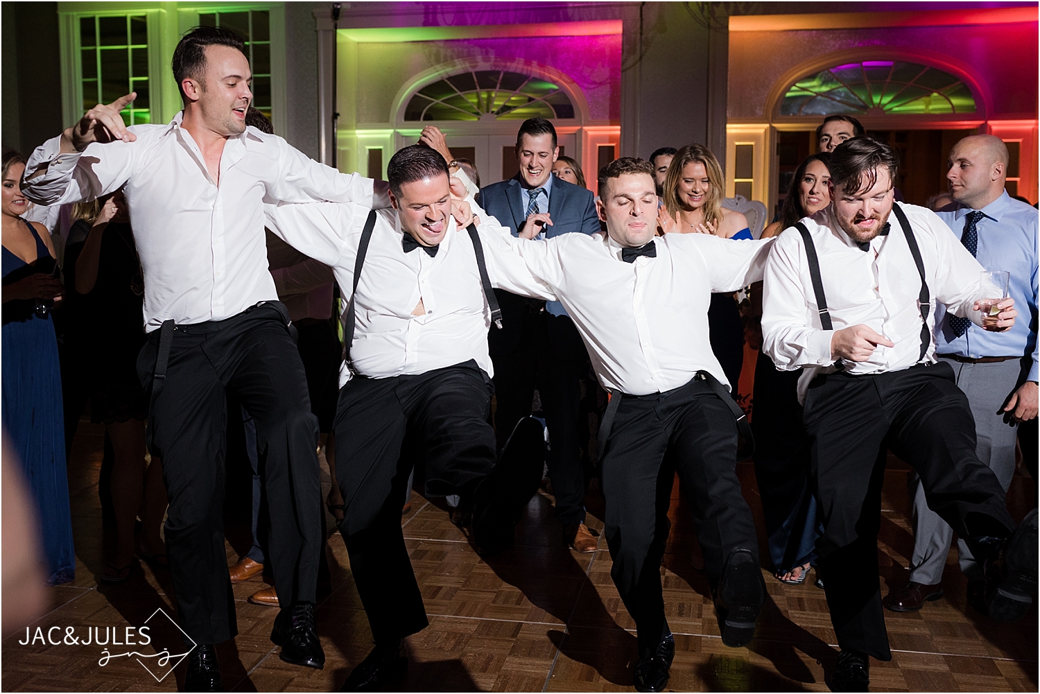 groom with his groomsmen dancing at wedding reception