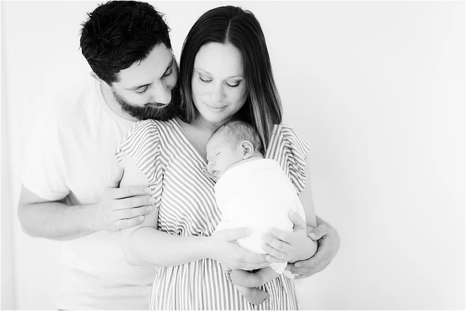 in home photo of newborn with parents