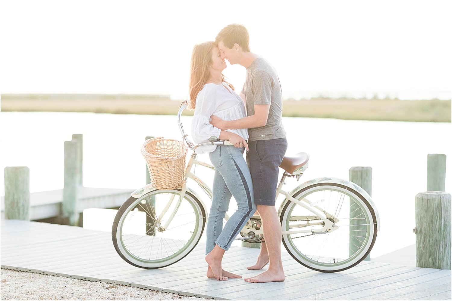romantic beach engagement photo in LBI with a bike