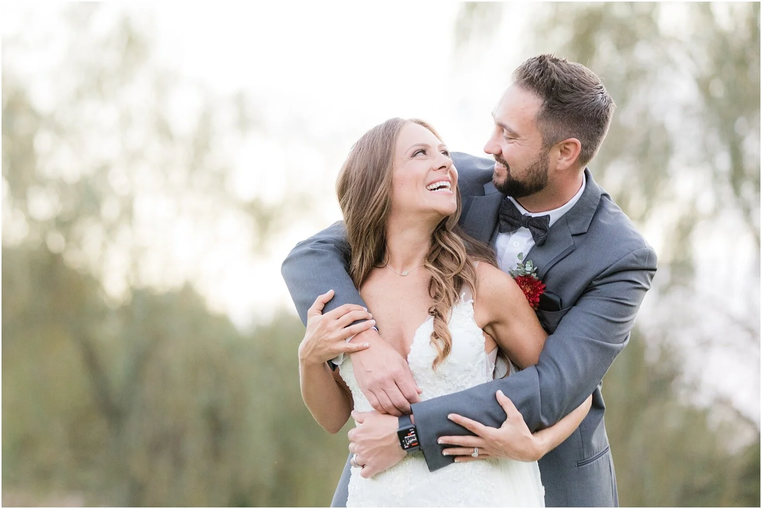 initmate Just married portraits of bride and groom at windows on the water frogbridge