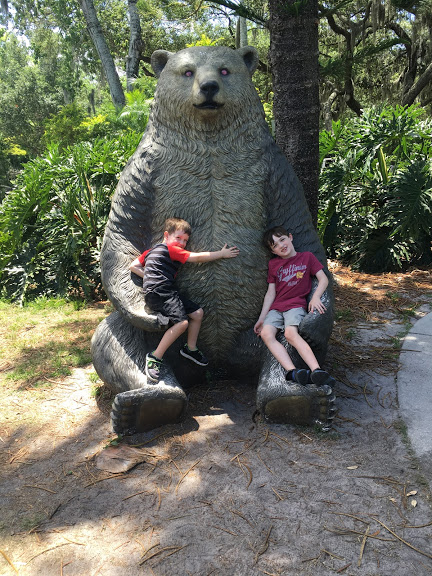 Boys with bear statue.JPG