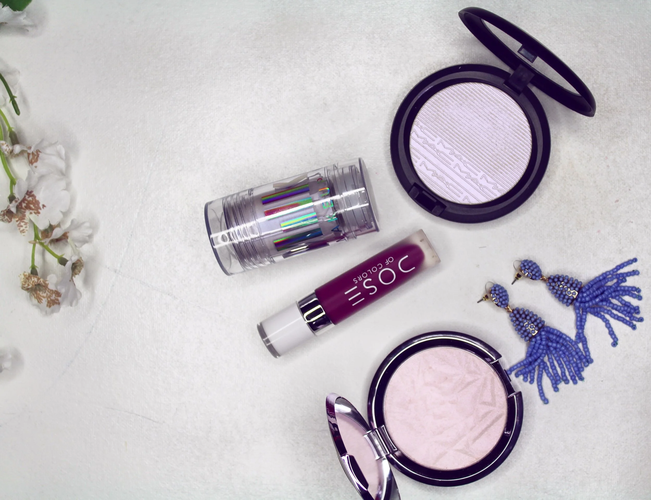 Milk Make-up Holographic Stick in Supernova, MAC Extra Dimension Skin Finish in Soft Frost and Becca Shimmering Skin Perfector Pressed Prismatic Amethyst
