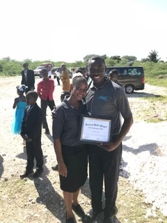 Pastor Nesly and his wife Yvenide with his certificate of graduation from the HTC