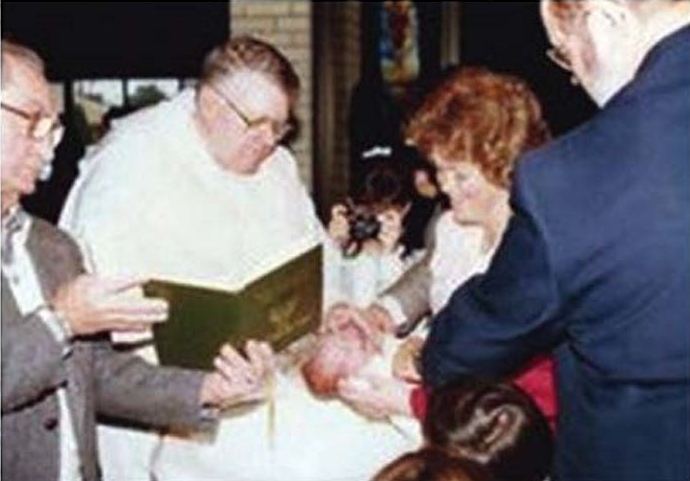Br. James Martin's baptism by Fr. Albert Coburn, O.P