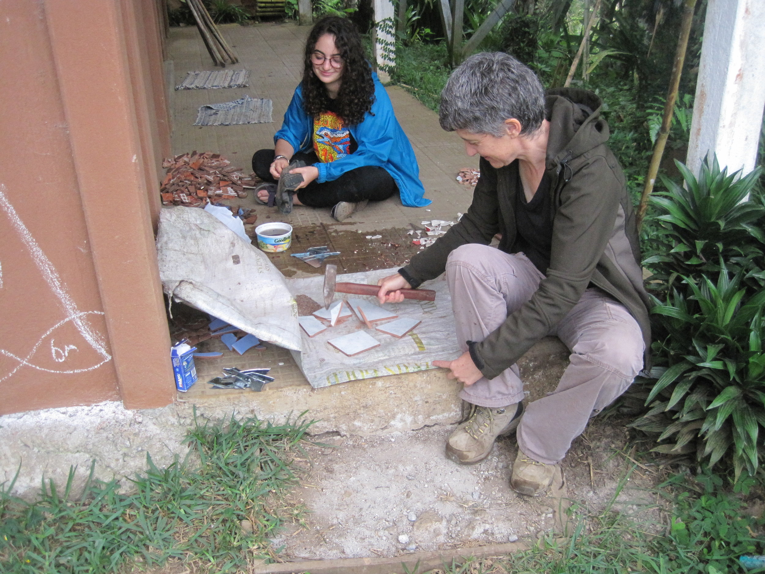  Breaking large tile pieces into smaller tile pieces with the help of Helen, one of my ICDS professors. 