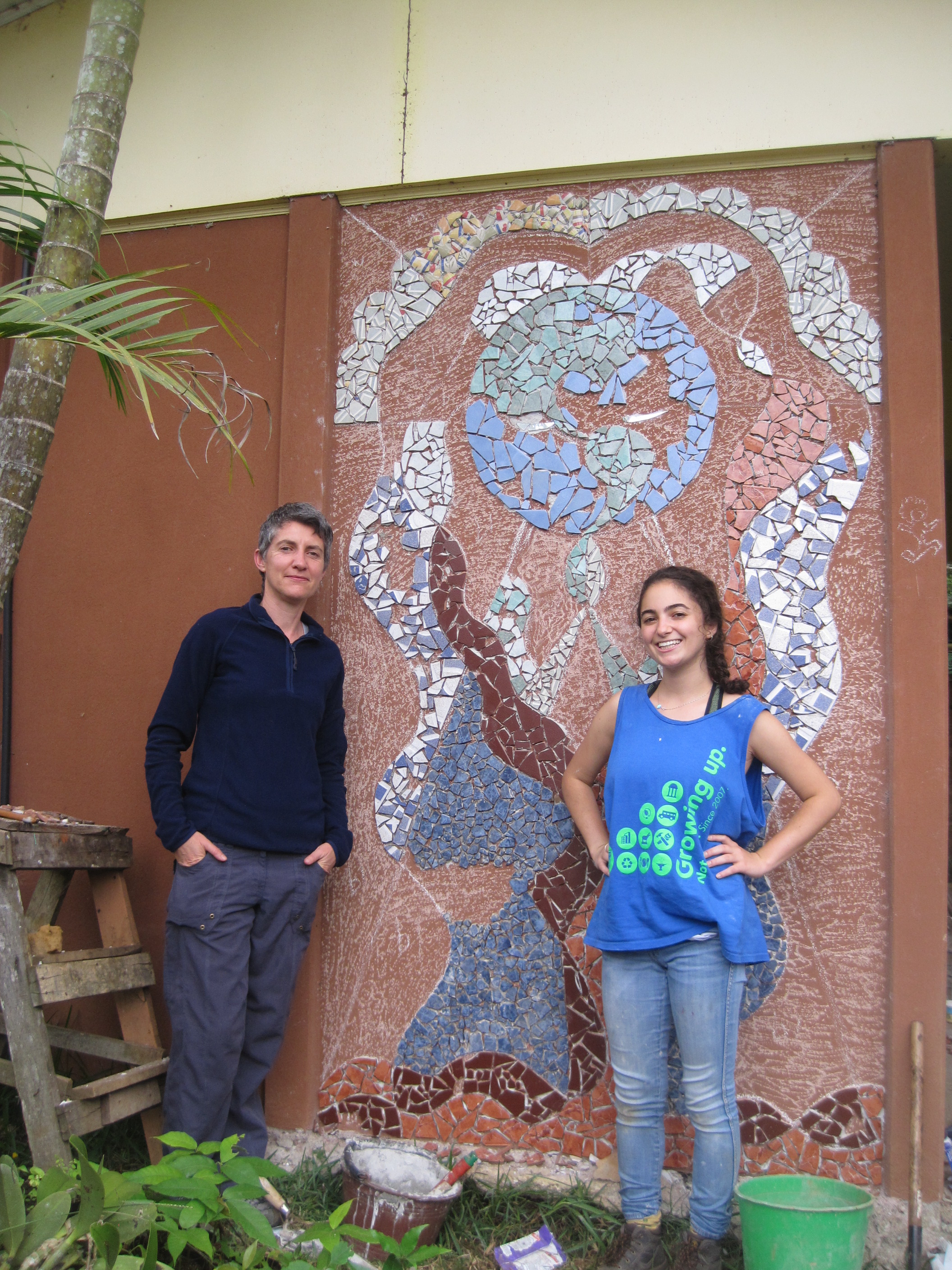  Helen, my ICDS professor, smiling with me for a photo before the in-progress mural. 