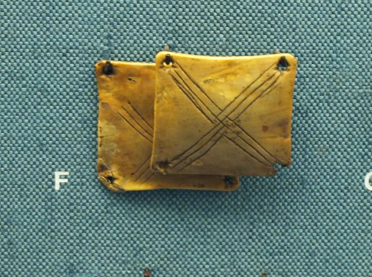 Decorated bone cards used for tablet weaving.