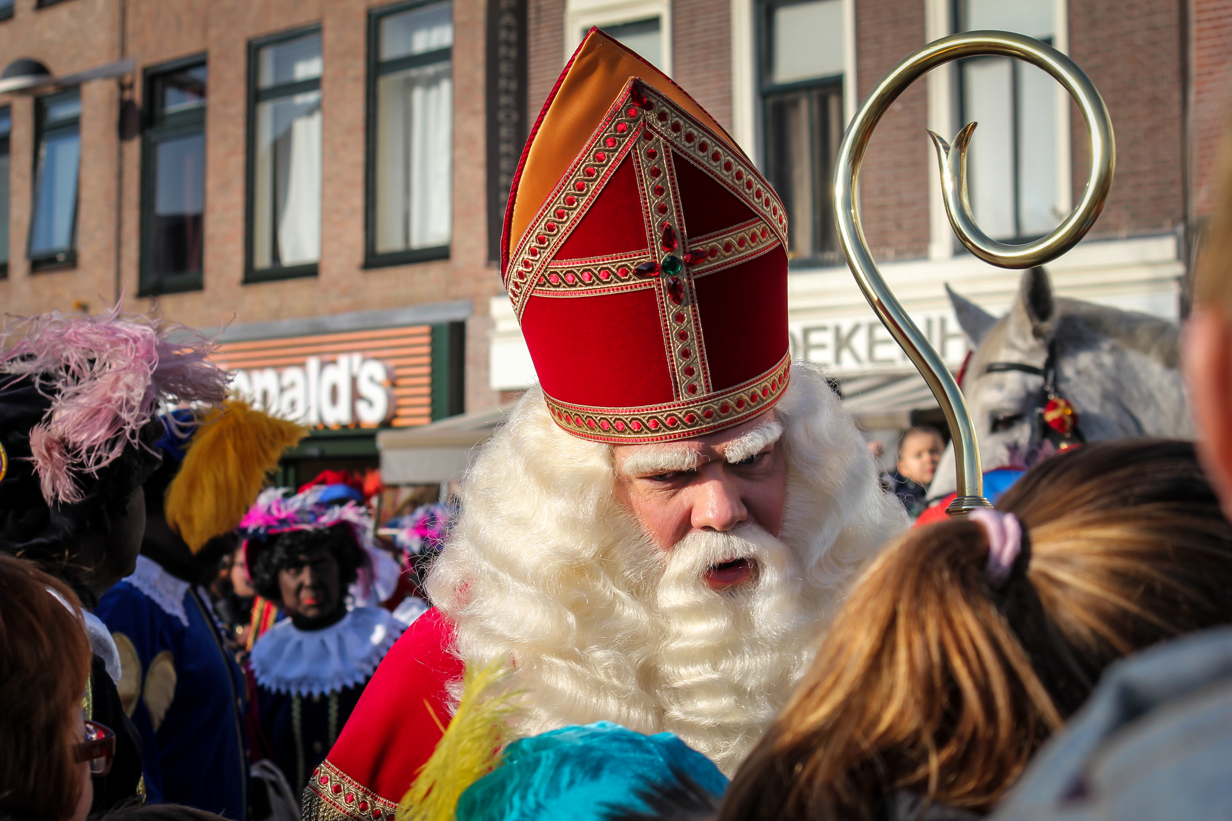 Sinterklaas prepares for the parade through the town but first stops to say some personal hellos.