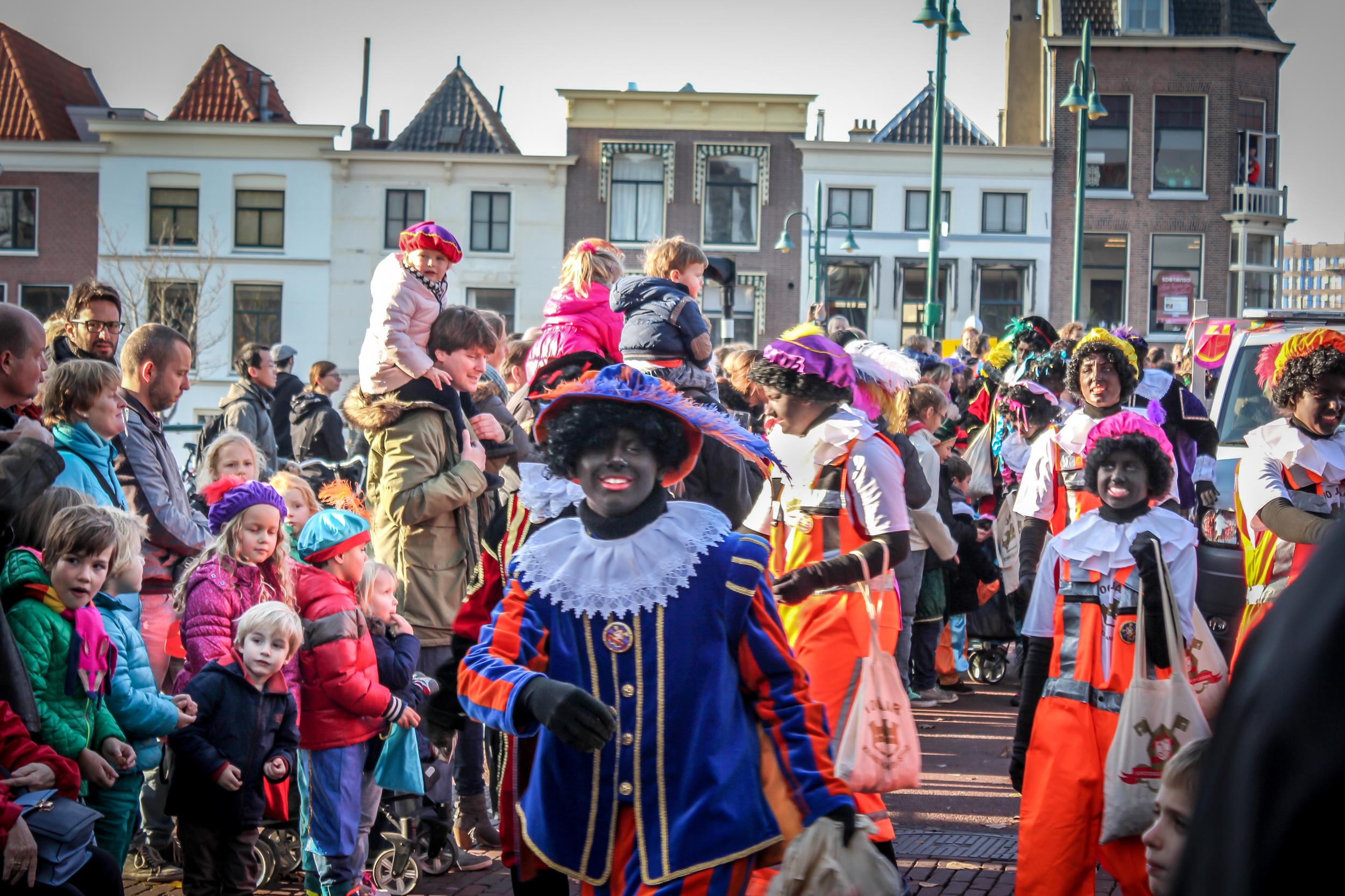 The parade starts and heads through the main streets towards town hall. There are many Black Pete around dancing and handing out Pepernoten.