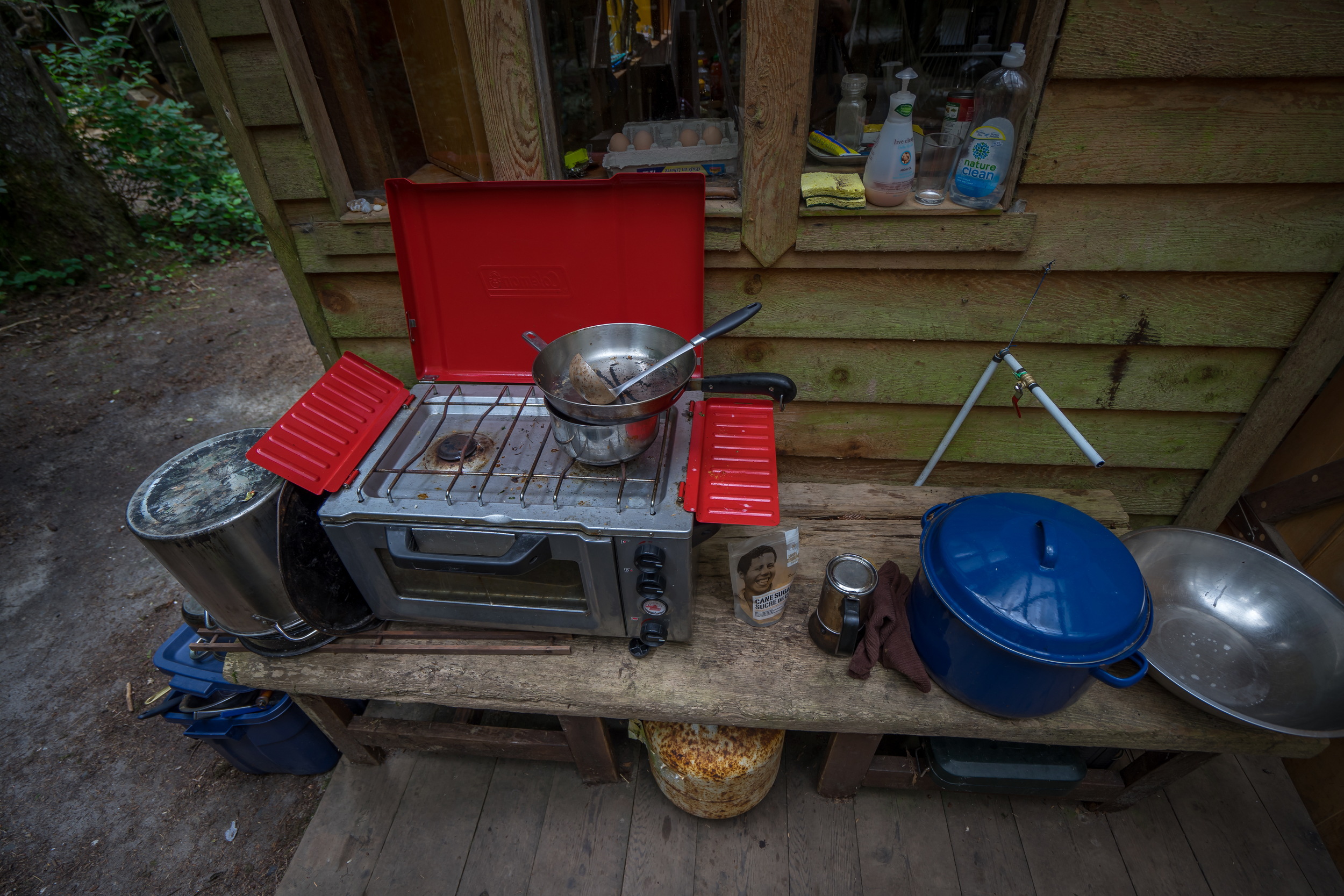 A combination of propane powered camping stoves and wood burning ovens and stoves allow the residents to cook their meals.