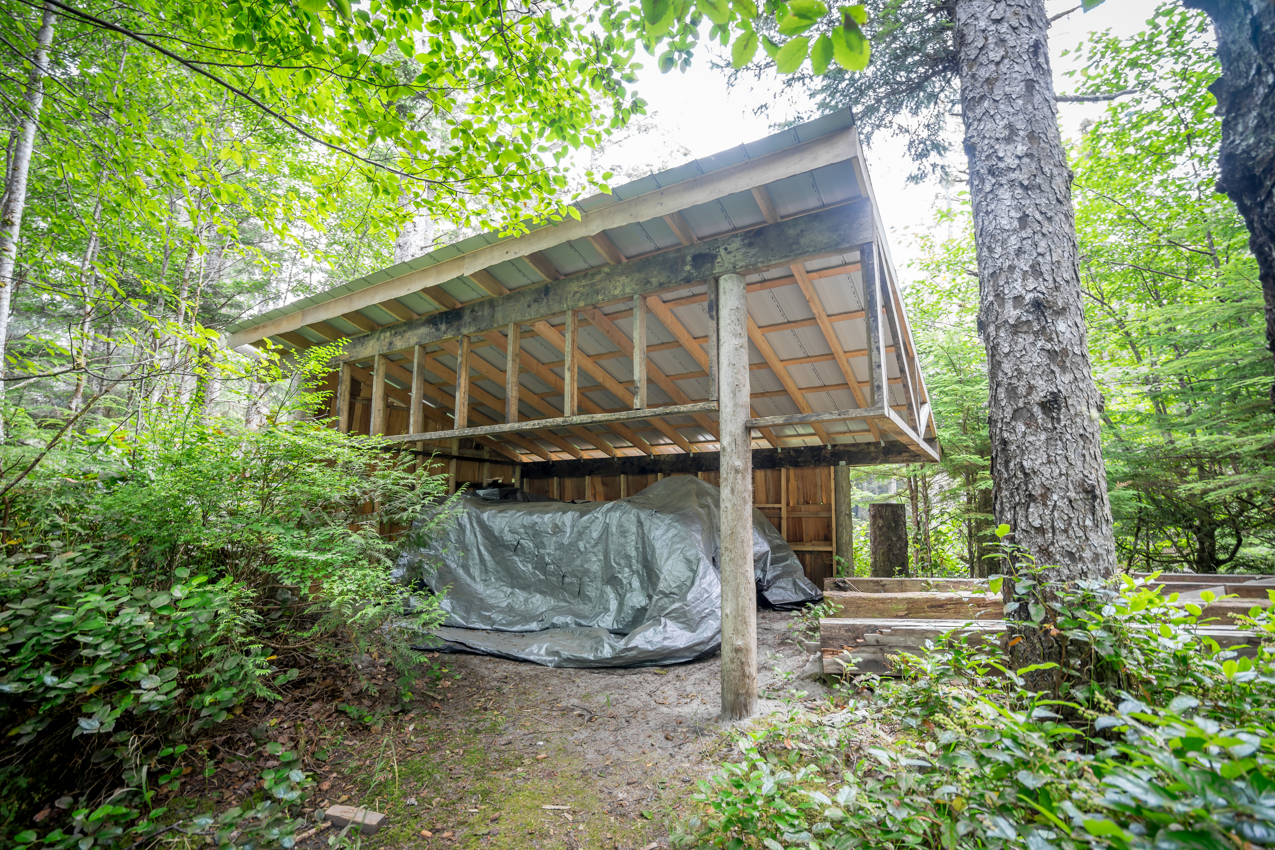  All water is collected by this roof which channels the rain into a large storage tank. &nbsp;The tank is located on top of a small hill for gravity to pressurize all the faucets. 