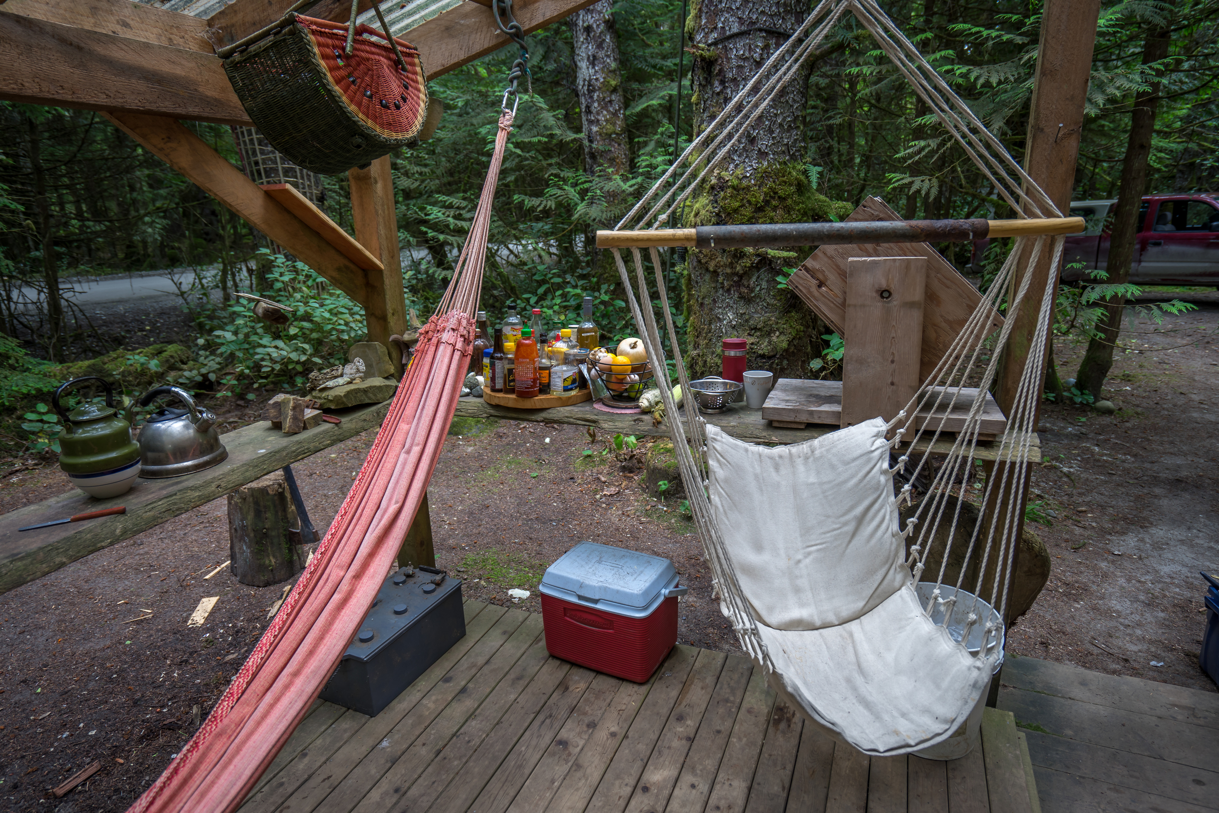  An outdoor living room as well as the small cooler for perishable food items. &nbsp;The cold climate here allows for other food items to be stored on the deck. 