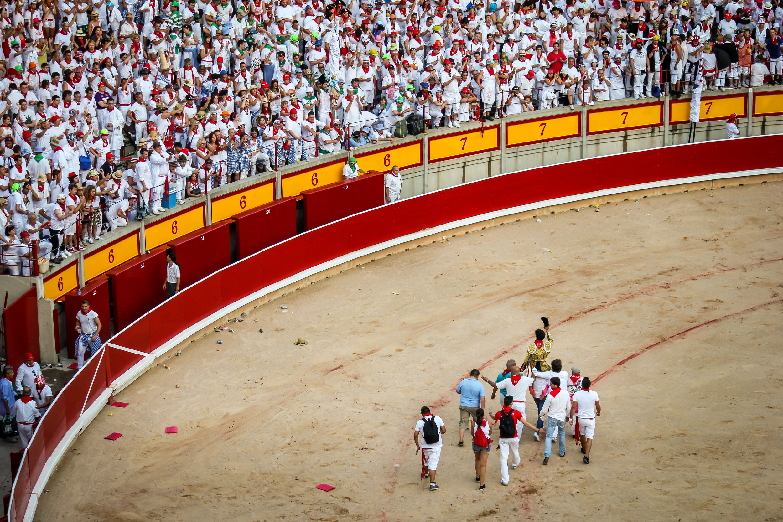 A matador celebrates by being paraded around the ring. A high score will allow the matador to cut of one or all of the bulls ears, and tail.