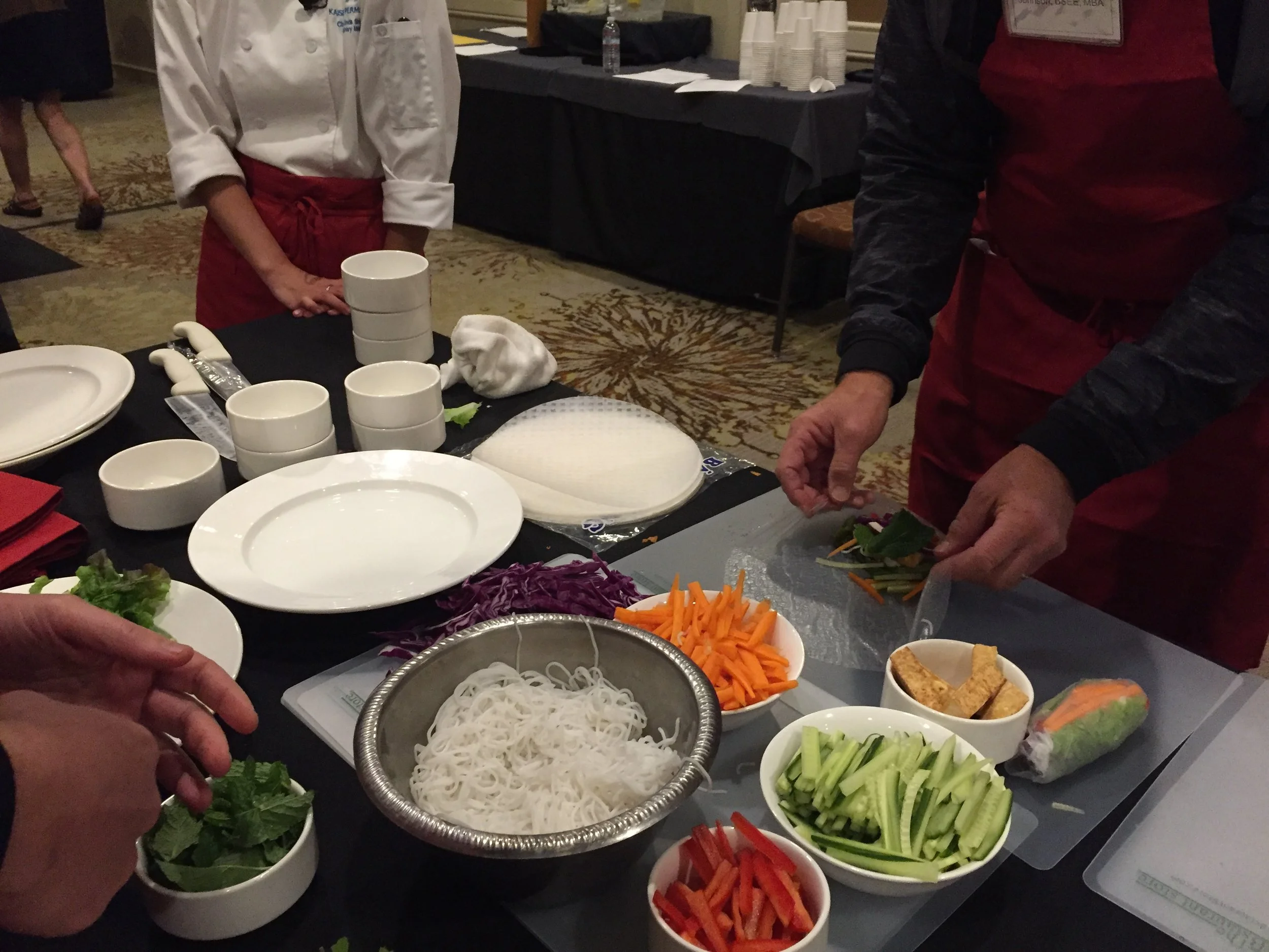 Preparing vegetable spring rolls at a workshop called "The Doctor Is In (The Kitchen): Cooking Delicious Food for Disease Prevention & Treatment"