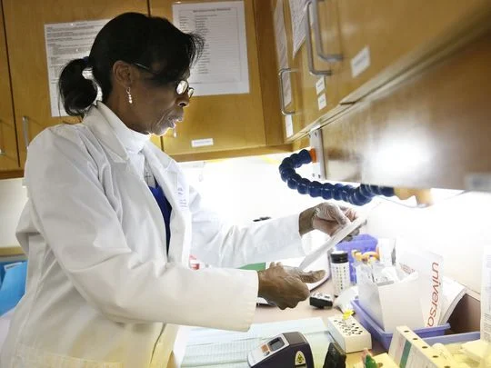  Jodie Strong, the nurse manager at TMH's Family Medicine Residency Program, demonstrates the processing of a rapid flu detection test. These tests, administered to patients with flu-like symptoms, can produce results in less than 15 minutes. (Photo: Hali Tauxe/Democrat) 