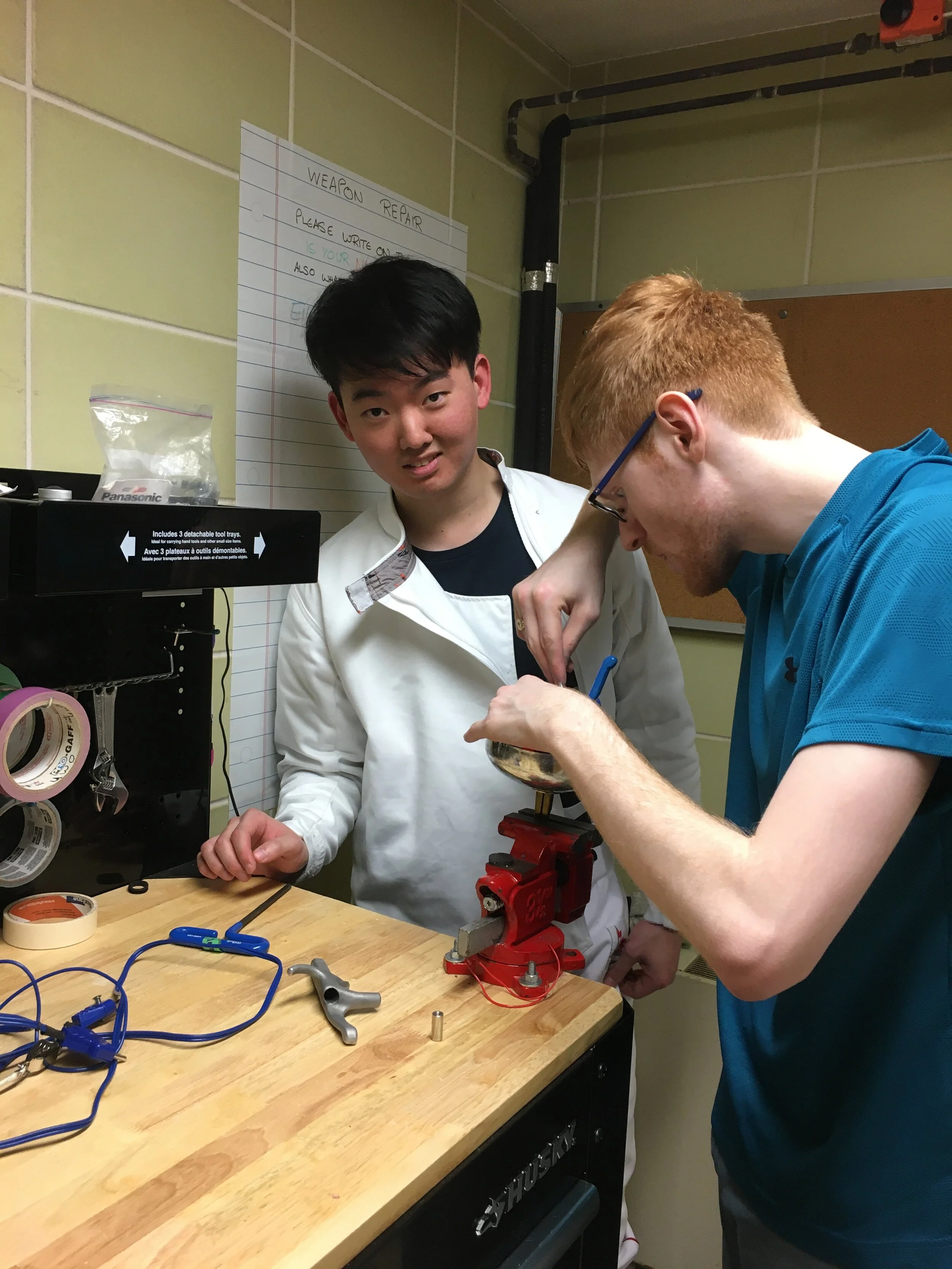 2019-20 Connor helping Joon Min with epee.jpeg