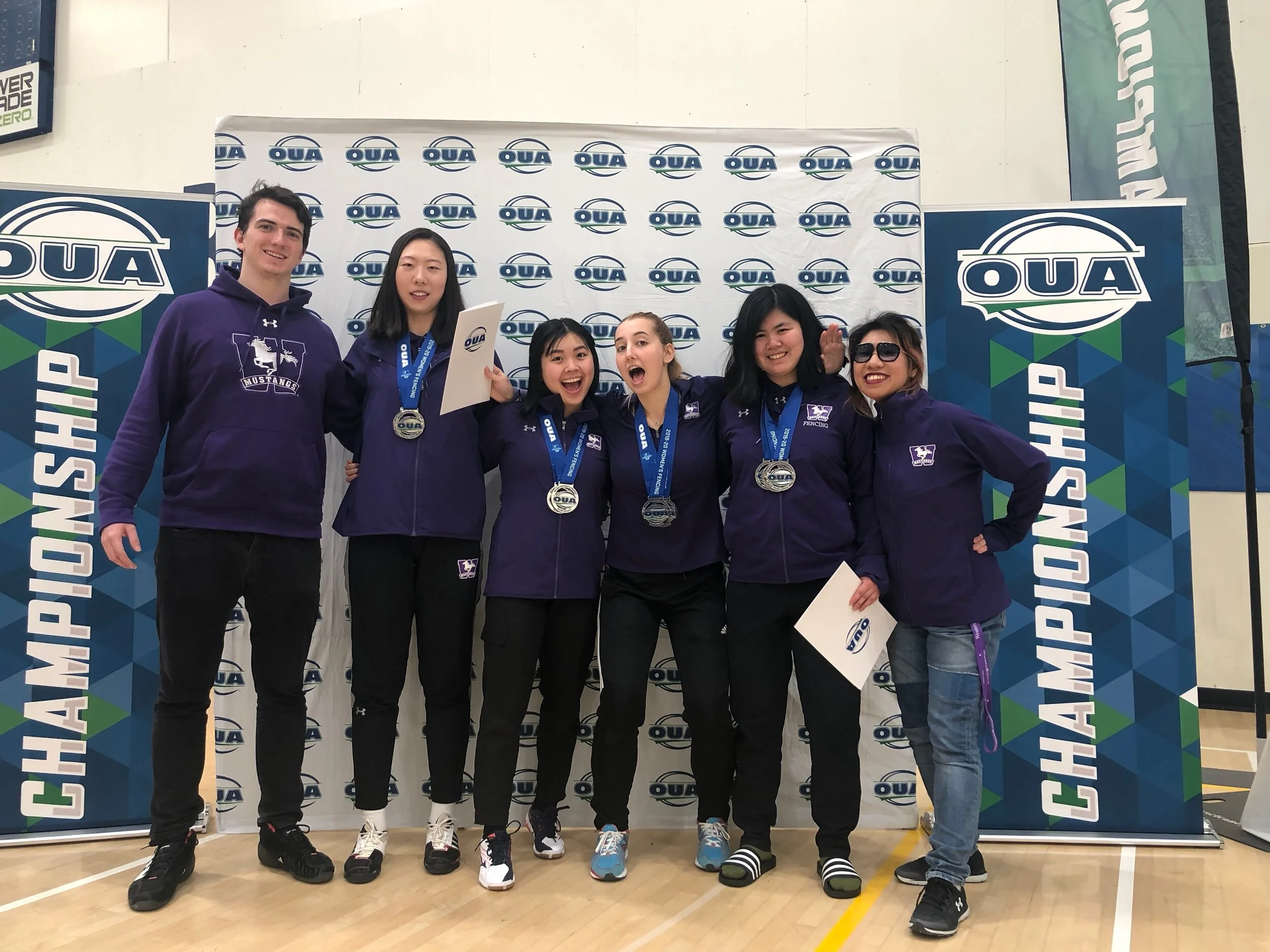 2019-20 Turner Tobin piste-side with Women's OUA Epee Team.jpeg