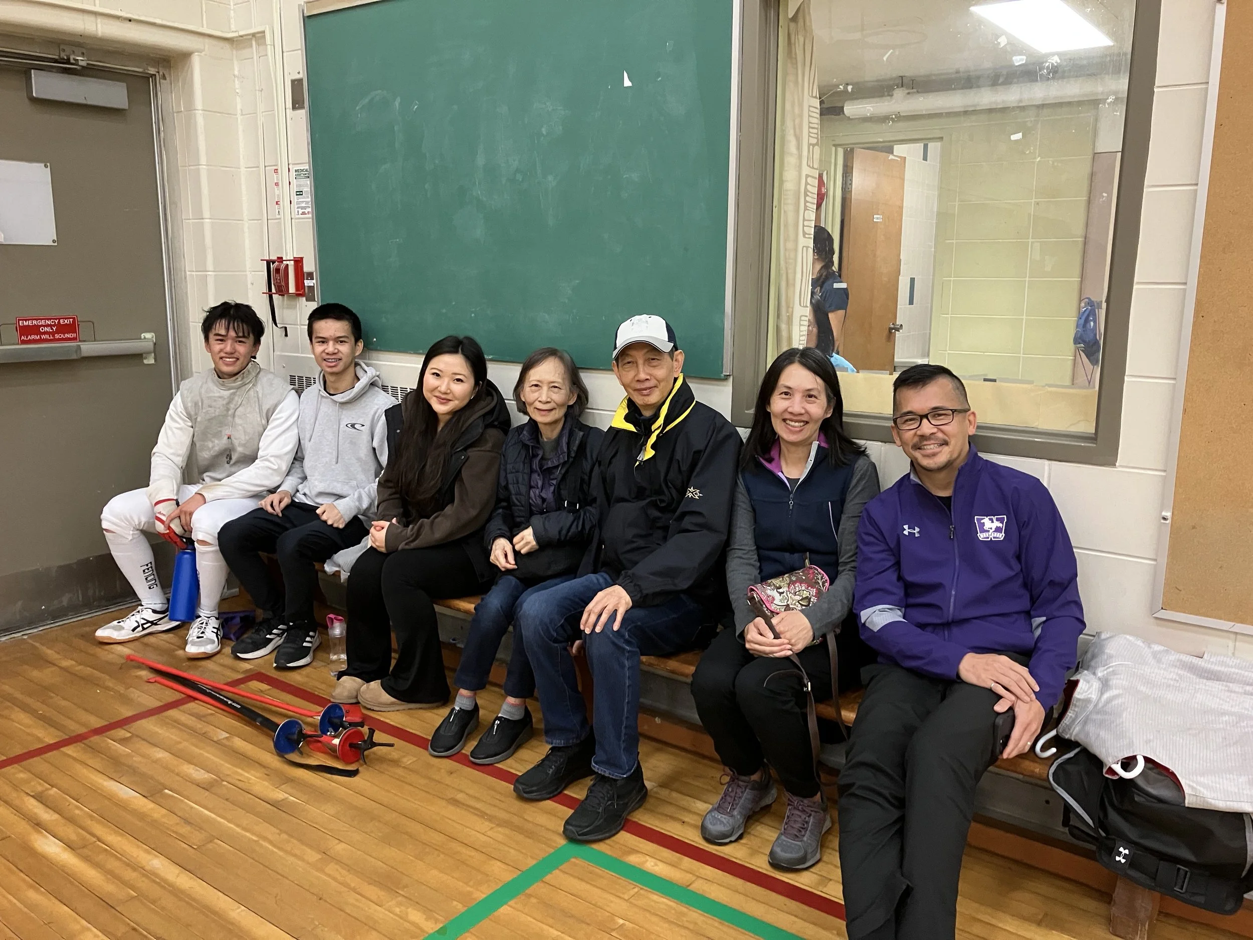 Justin Quong, alumni assistant coach and family.jpeg