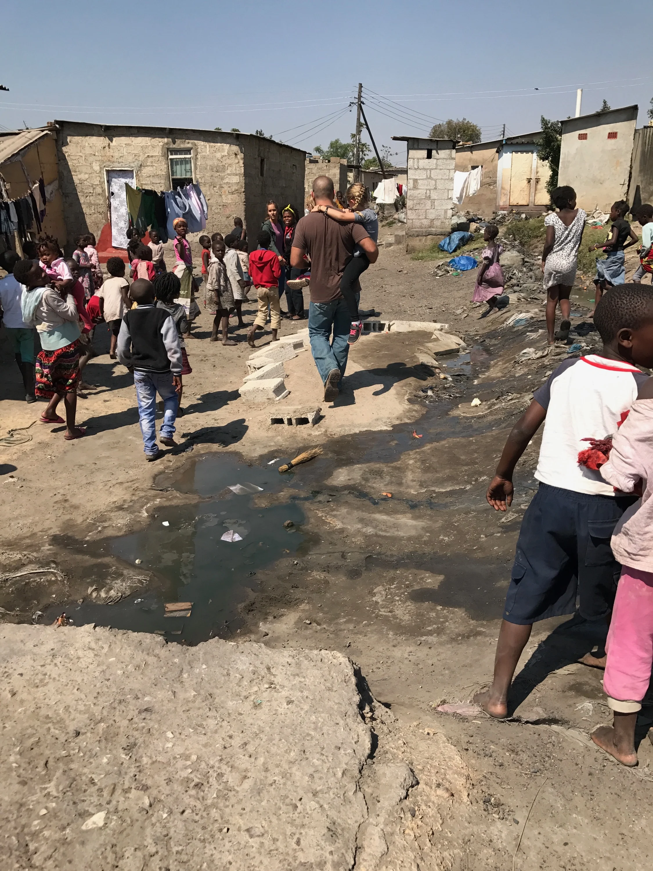 Walking through Chaisa, one of the many compounds in Lusaka that Family Legacy is rescuing children from.