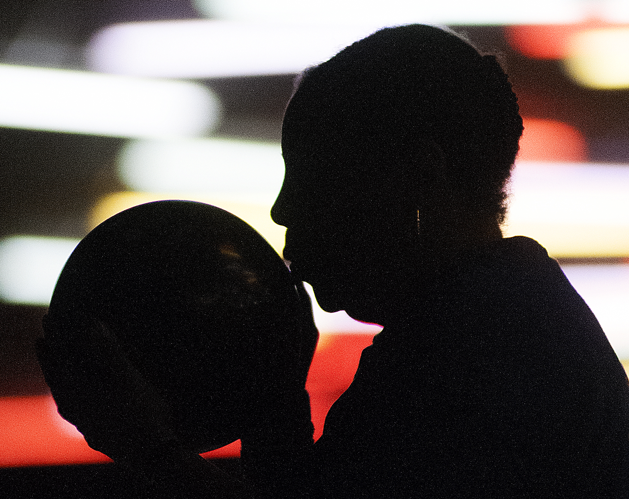Faye Matter, 70, of Cheltenham, kisses her ball before her throw while participating in her first year of the bowling competition in the 70-74 age bracket during the opening day of the Bucks County Senior Games at Brunswick Zone XL in Lower Southampton on Monday, June 1, 2015.