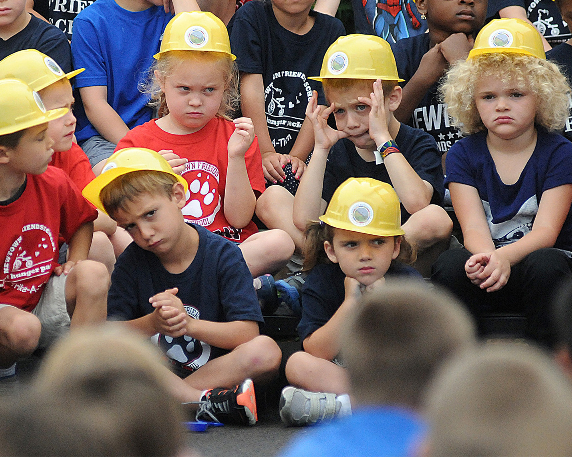  Newtown Friends School pre-kindergarteners and first graders fidget during the presentation before the groundbreaking for for their new construction project at the school. 