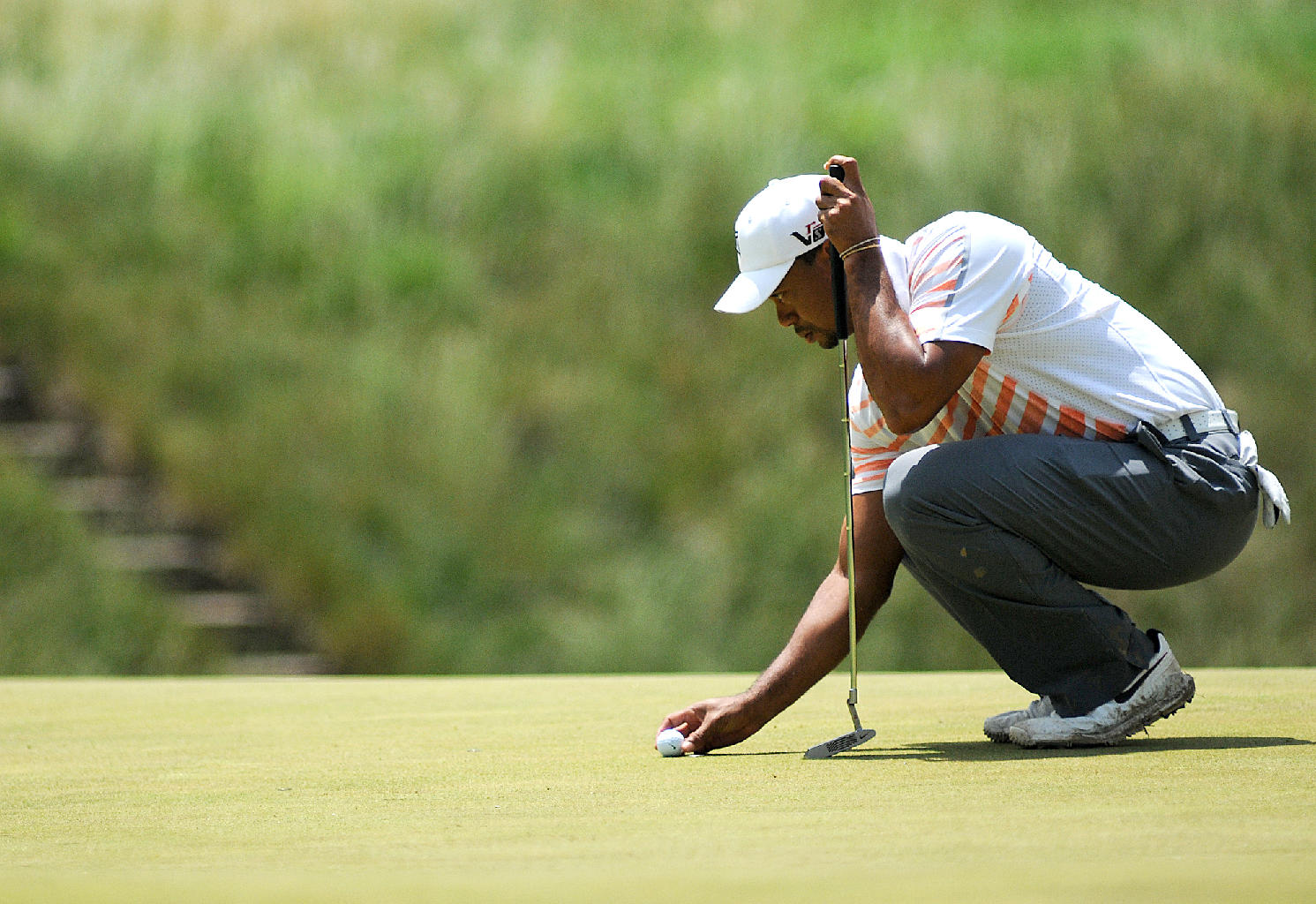  Tiger Woods prepares to put at Hole 17, a par of 3, during round 2 of the U.S. Open at Merion Golf Club. 