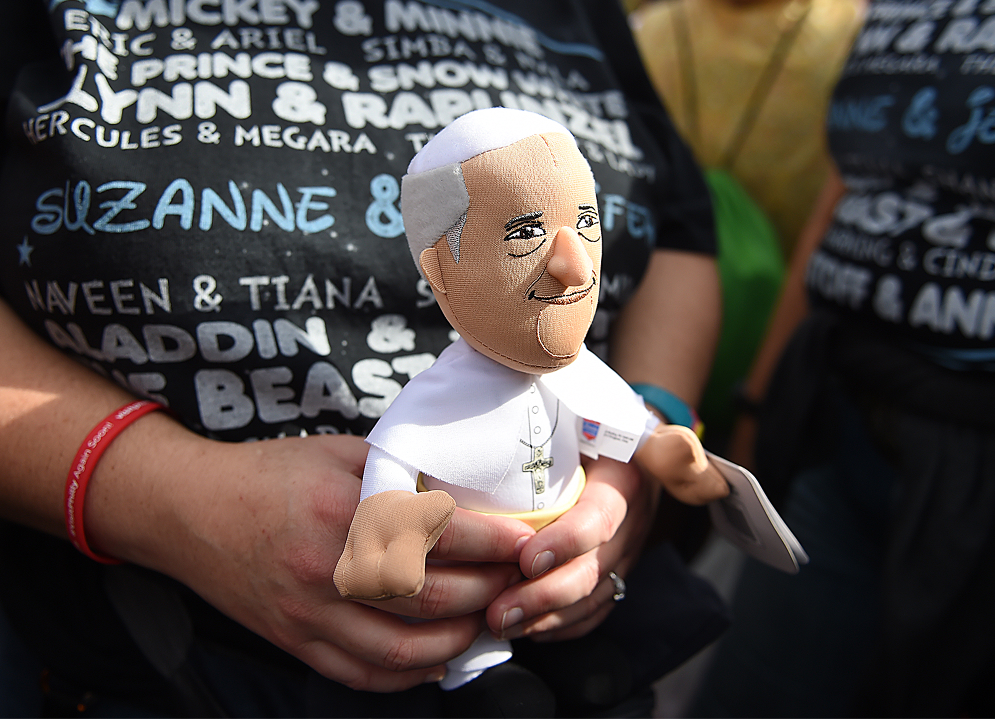  Suzanne McErlain of Horsham holds onto her cherished Pope souvenir as Pope Francis speaks at Independence Hall on September 26, 2015. 