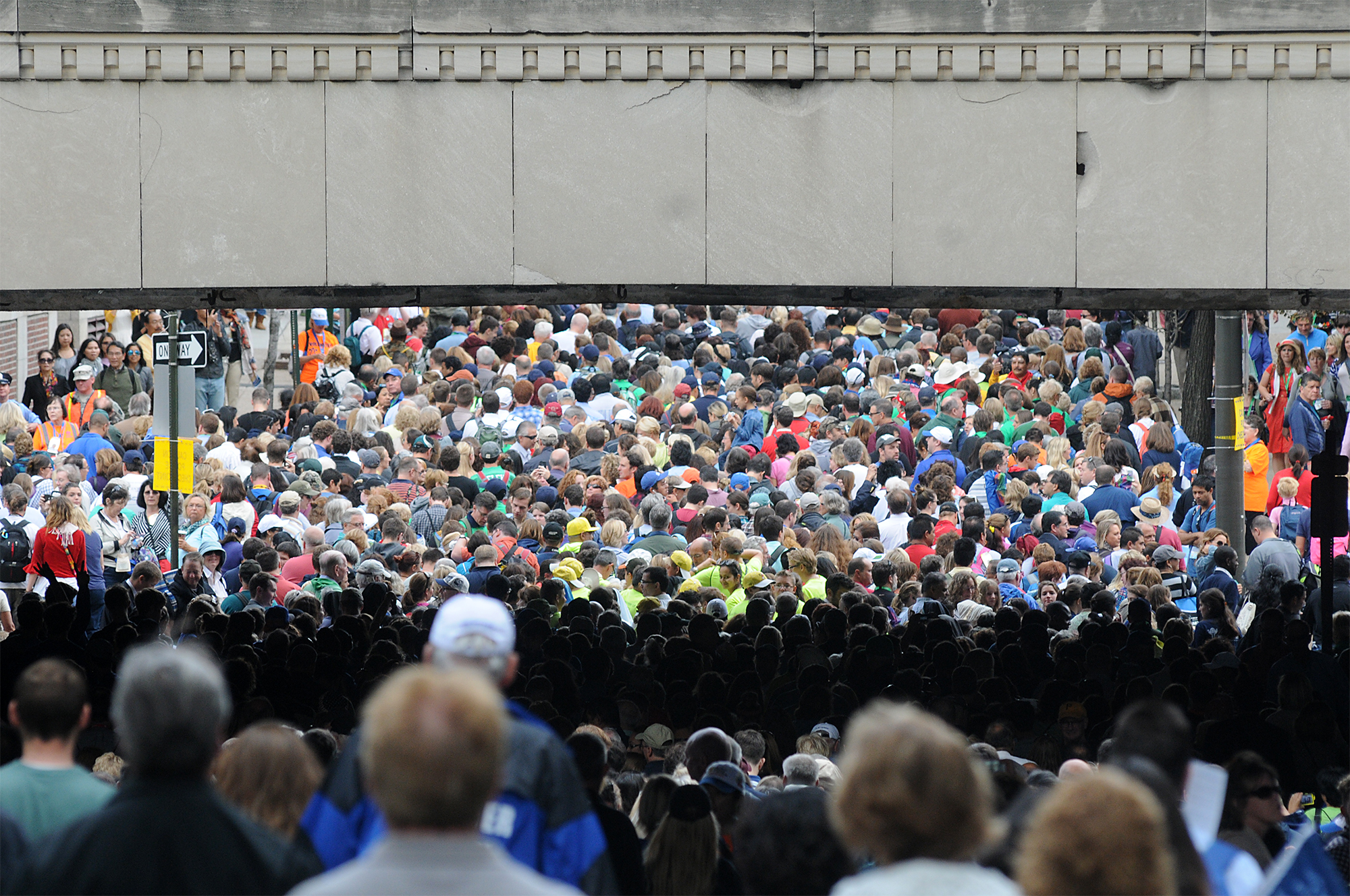  People line up on 21st street while waiting to see Pope Francis' Mass on the Ben Franklin Parkway on September 27, 2015. Lines were multiple hours-long waits with no bathrooms or handicap entrances along the route. 