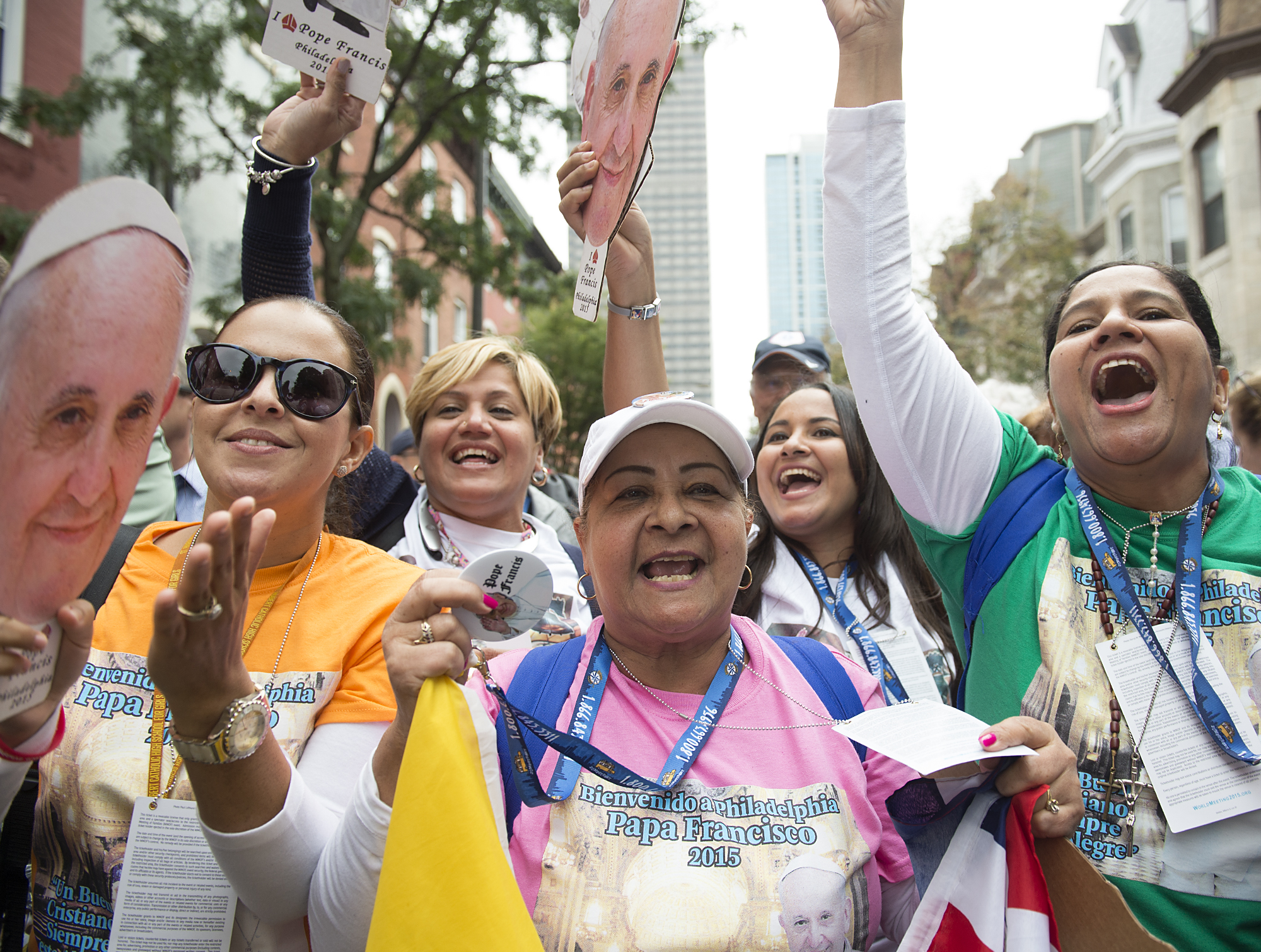  Maria Rodriguez of the Dominican Republic sings with her group and chants "El Papa esta presente," while waiting to see Pope Francis' Mass on the Ben Franklin Parkway on September 27, 2015. Lines were multiple hours-long waits with no bathrooms or h