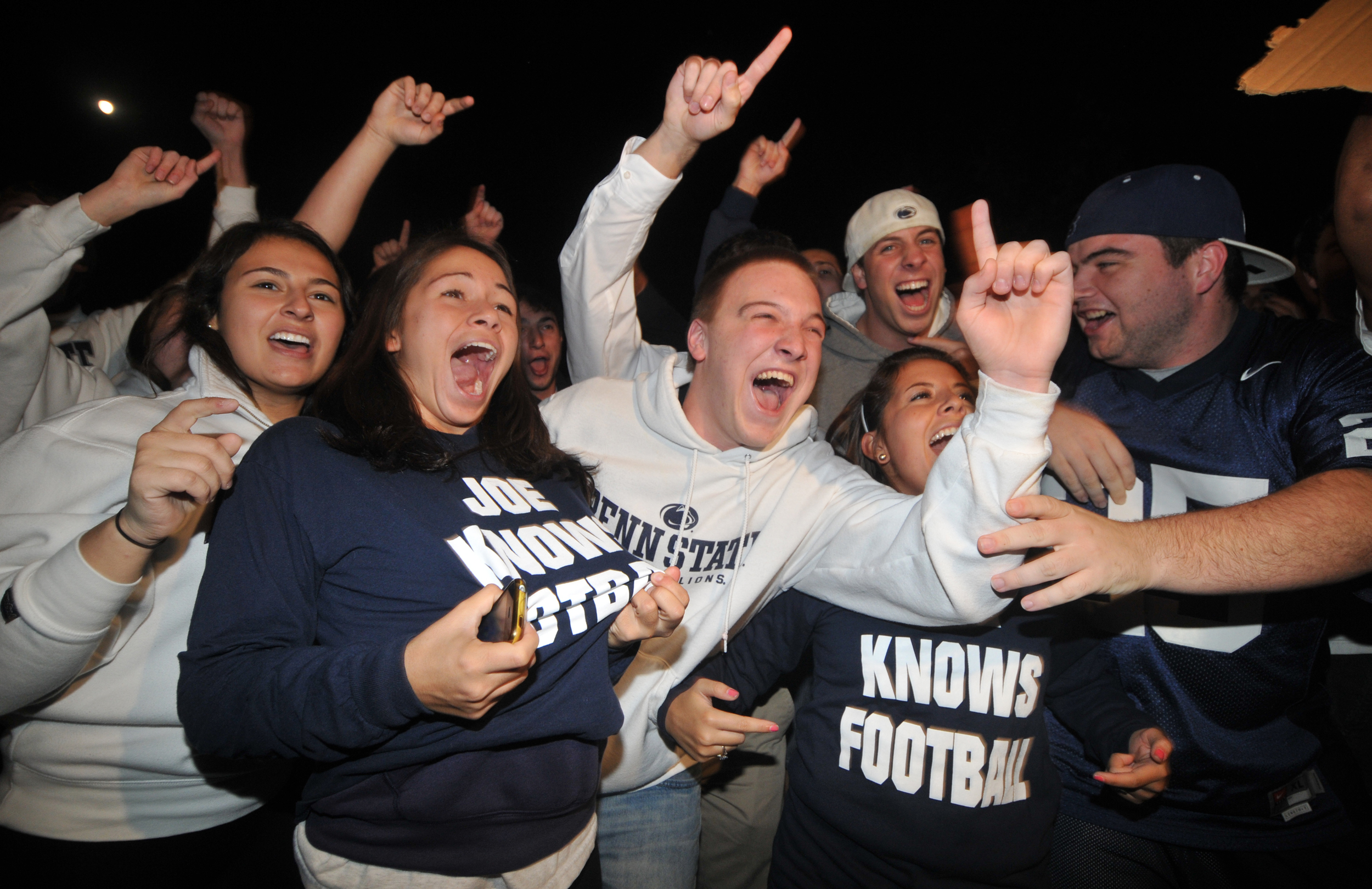  Students show their support for head coach Joe Paterno and their Penn State pride outside of Paterno's home in State College on Tuesday night. A crowd of around 300 chanted things such as "f*** the media," "beat Nebraska," and "Joe-pa-terno." 