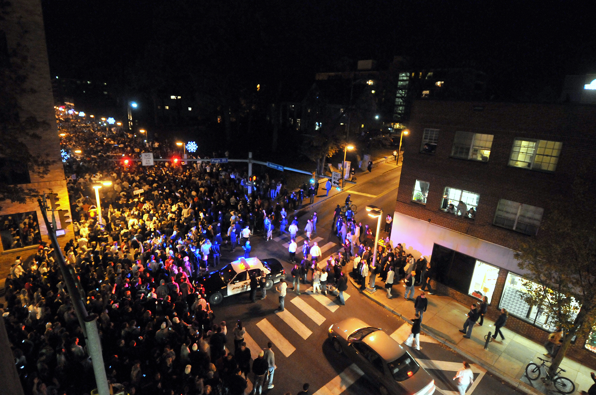  Students flooded onto Beaver Avenue on Wednesday, Nov. 9, 2011 from Old Main to protest the firing of Joe Paterno. This intersection, at Beaver and Pugh, was blocked off by police vehicles. Riot police were on standby during the press conference in 