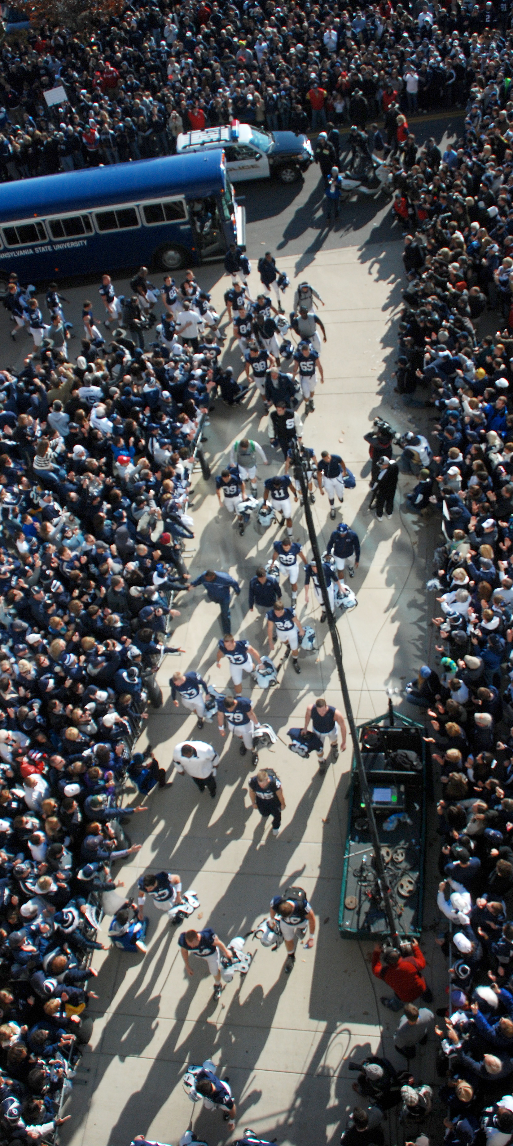  Football players step off their buses to and greet fans as they enter the stadium before their game against Nebraska on Saturday, Nov. 12, 2011. 