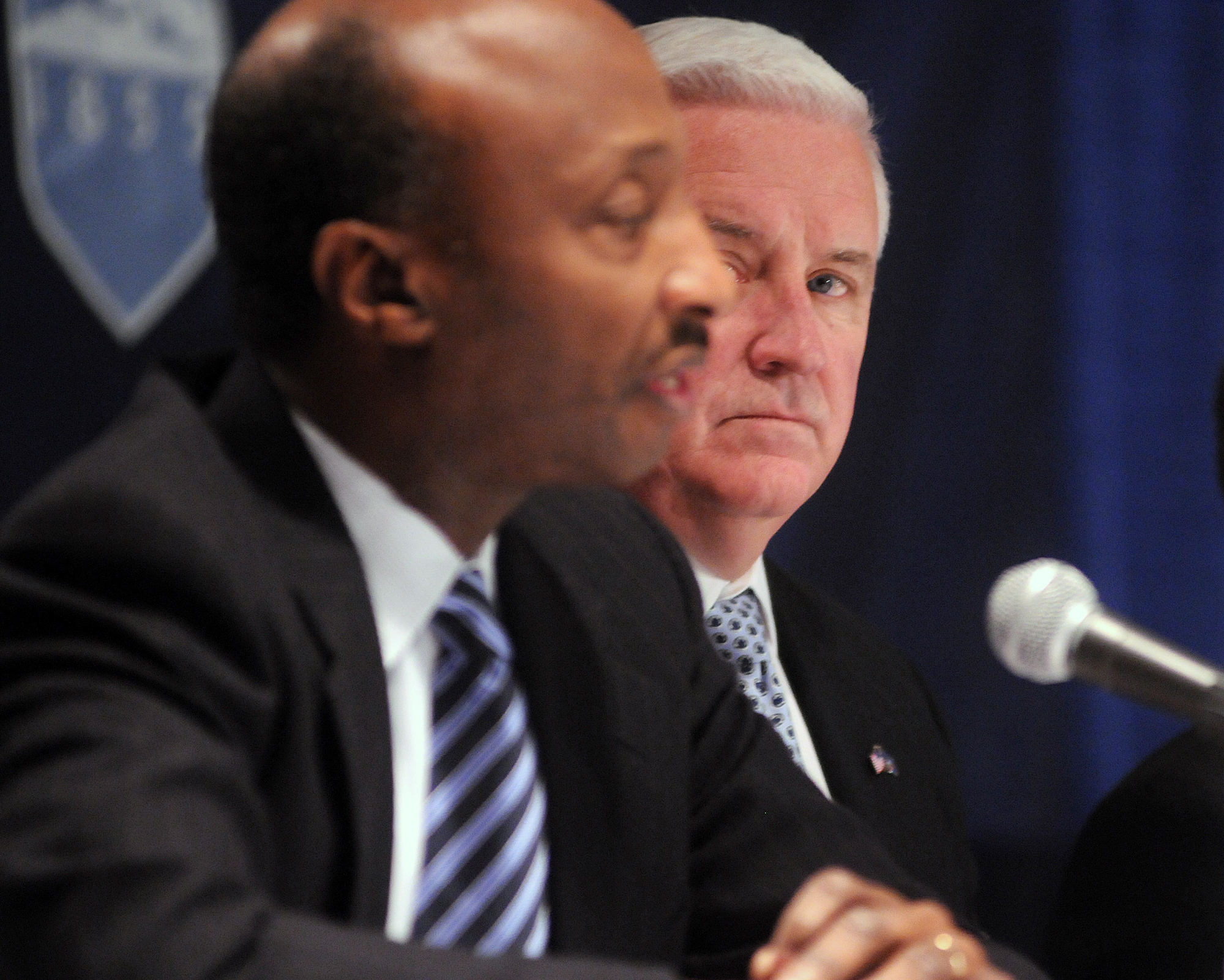  Governor Tom Corbett, right, watches as Kenneth Frazier, chairman of the investigative committee, speak to media following the Board of Trustees meeting on Friday, Jan. 20, 2012 at the Nittany Lion Inn. 