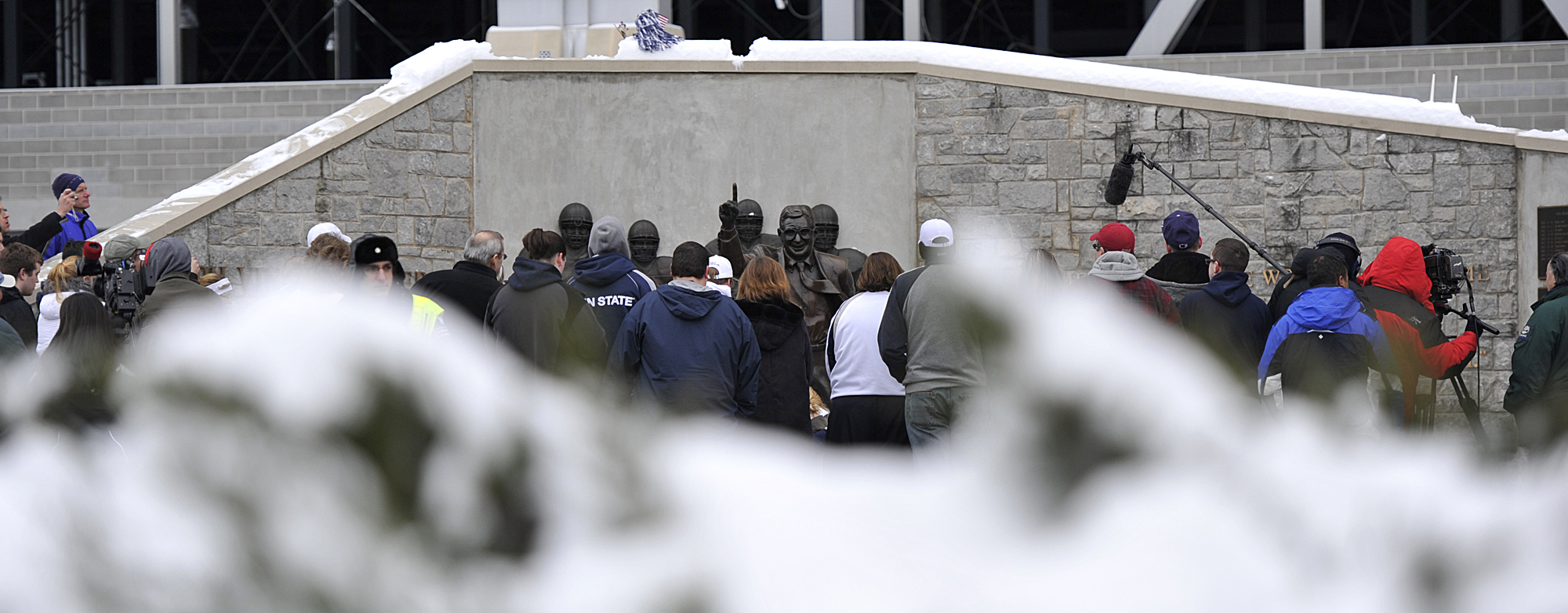  Crowds gather around the Joe Paterno Statue on Sunday, Jan. 22, 2012 after learning of his death due to complications with lung cancer. 