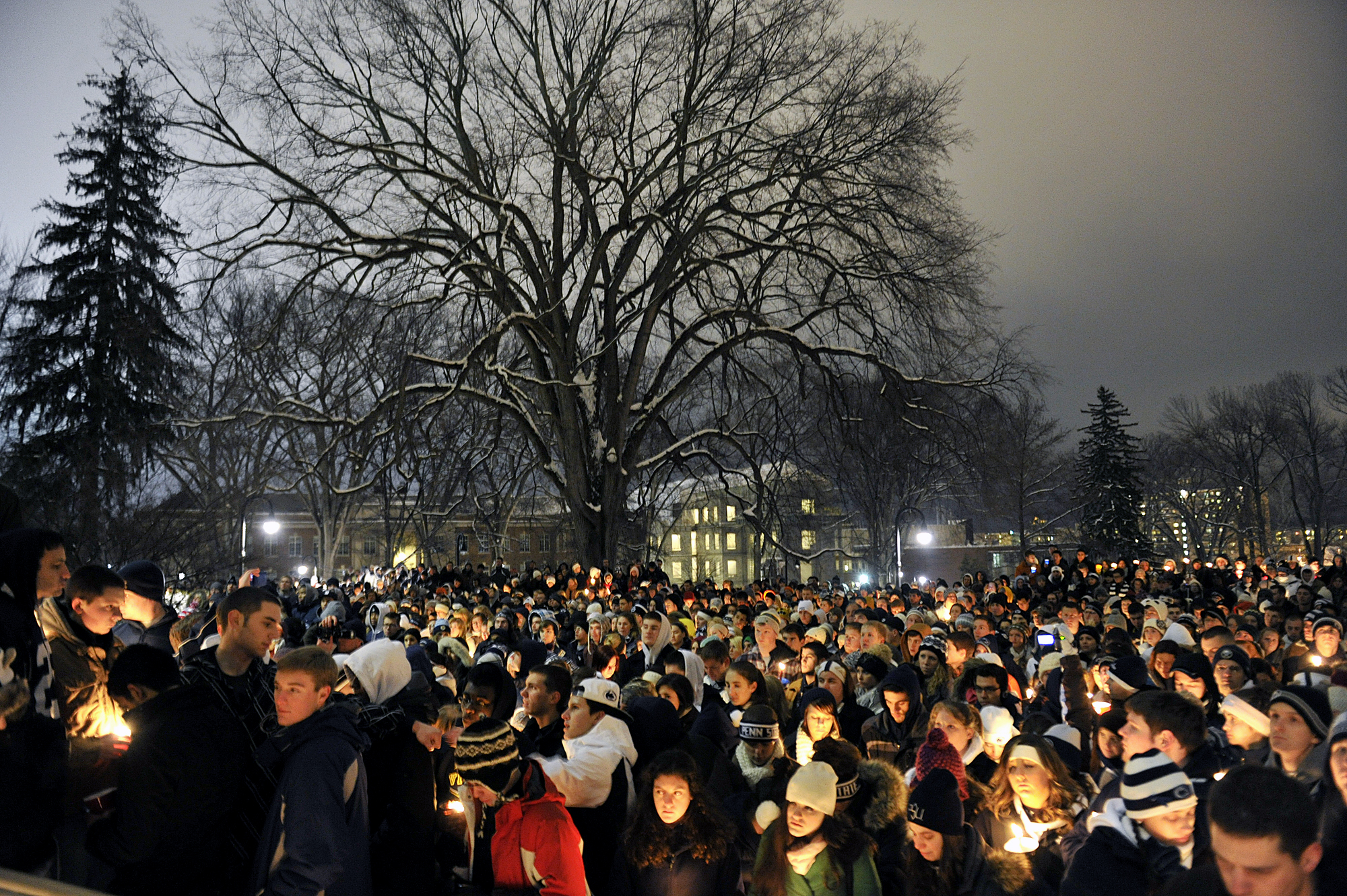  Students and community members gather on the Old Main lawn on Sunday, Jan. 22, 2012 for a vigil honoring Joe Paterno. 