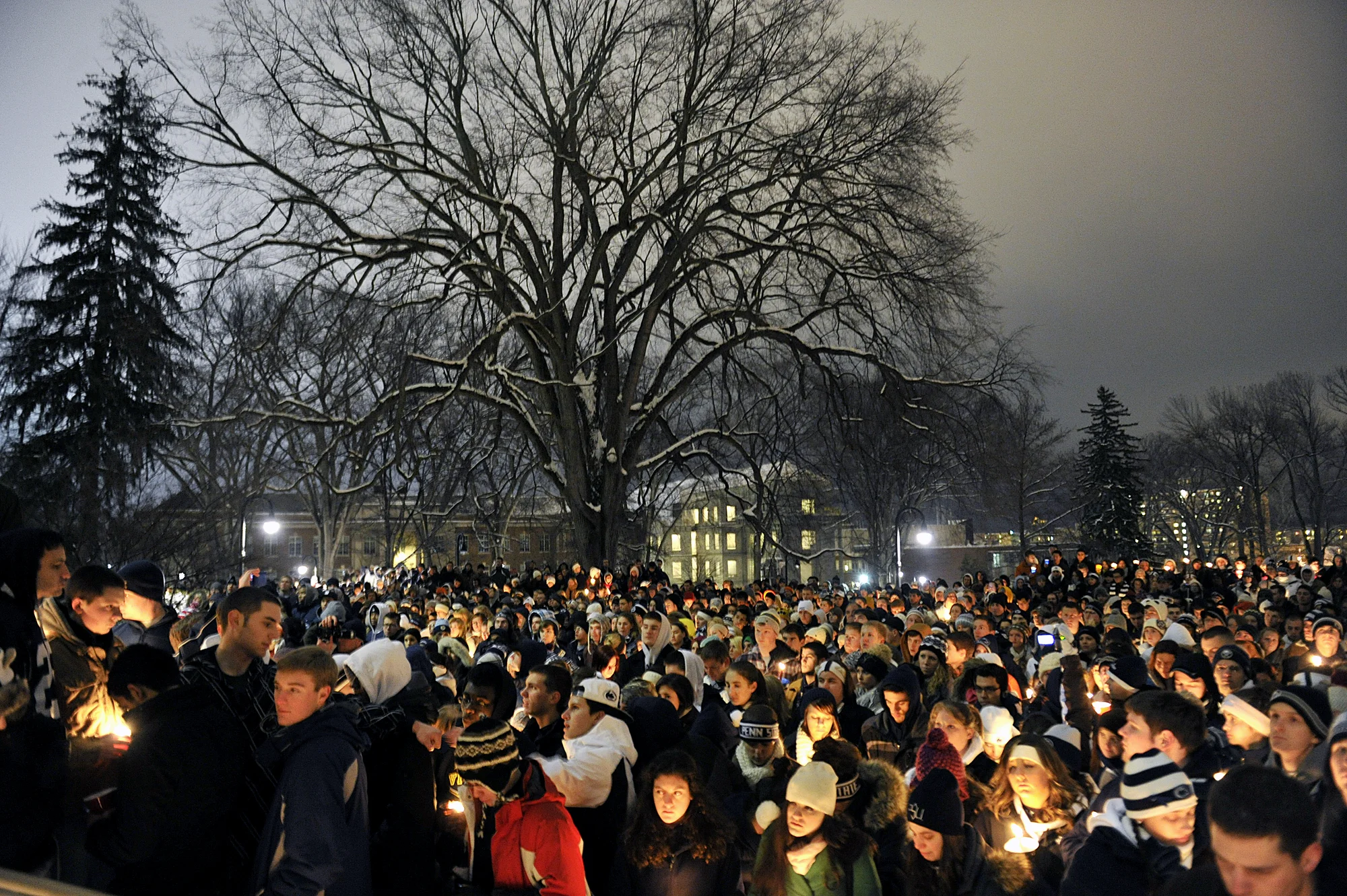 Students and community members gather on the Old Main lawn on Sunday, Jan. 22, 2012 for a vigil honoring Joe Paterno.