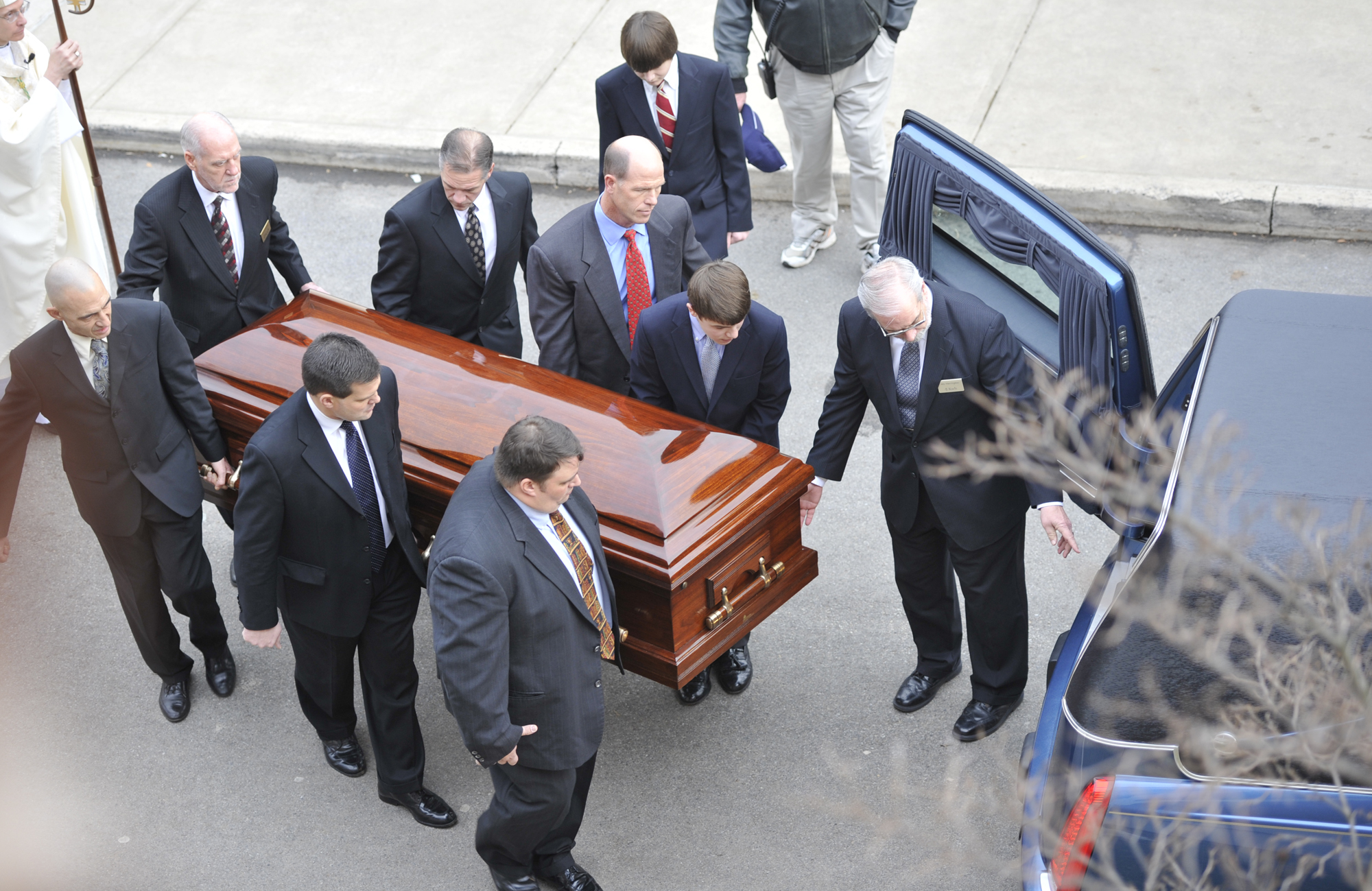  Pallbearers carry the casket of former head football coach Joe Paterno to the hearse parked outside of the Pasquerilla Spiritual Center on Wednesday, Jan. 25, 2012 before the funeral procession around State College. 