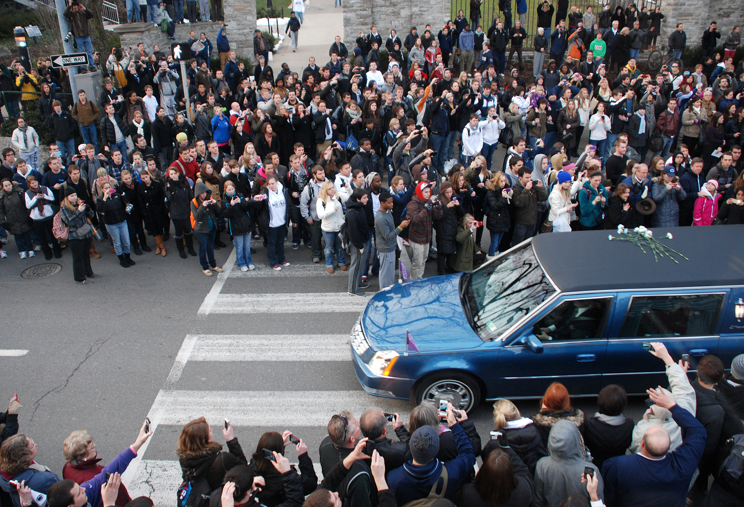  A hearse carrying the casket of Joe Paterno drives by the Allen Street gates on Wednesday, Jan. 25, 2011 during the funeral procession from the Pasquerilla Spiritual Center to a private burial. 