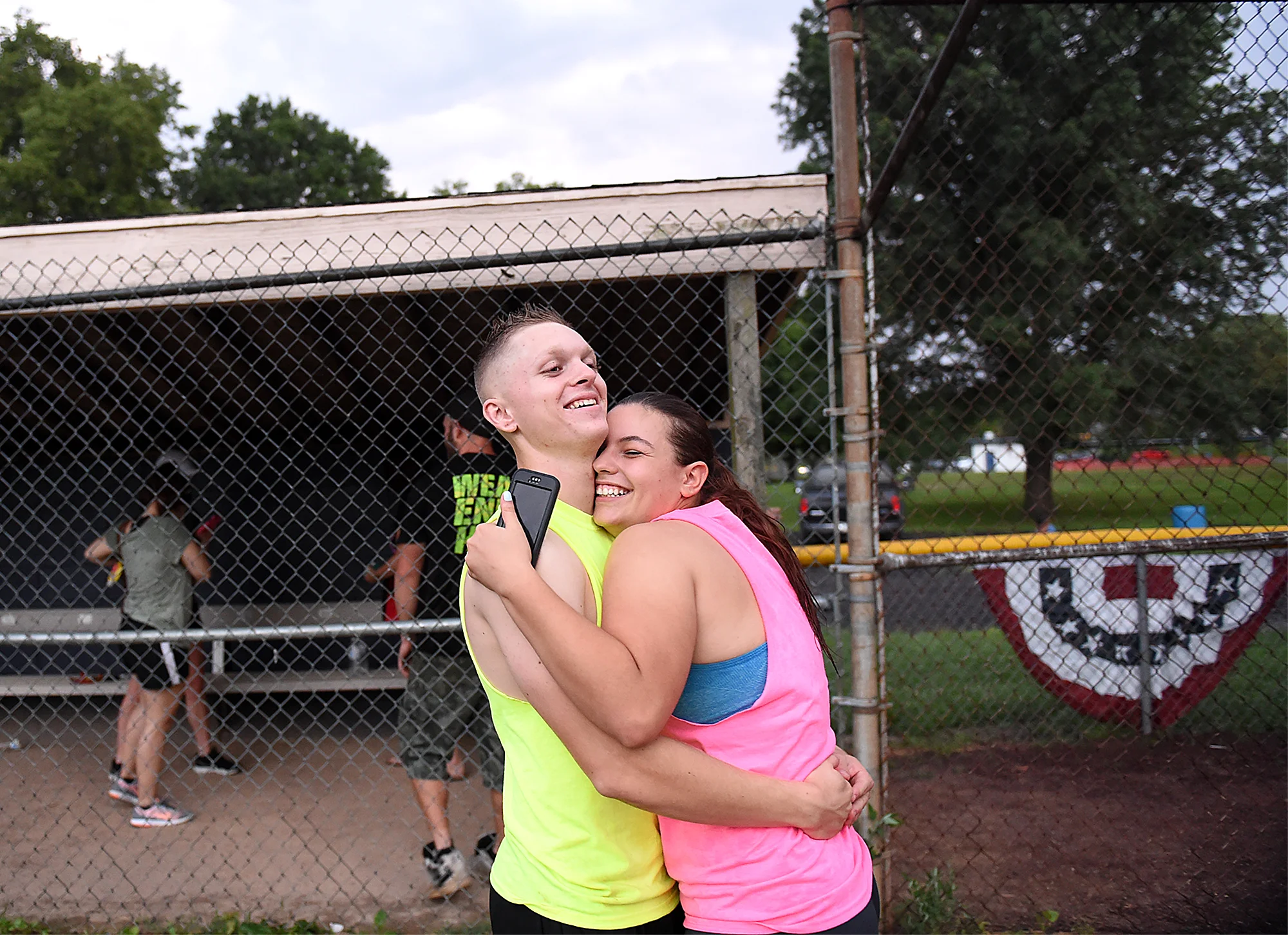  Deidra "Dee" Hubay, 18, originally of Middletown Township, hugs her then fiancé and now husband Dan Bryan, 19, also originally of Middletown Township, while playing kickball with family friends on Tuesday, July 21, 2015 at Williamson Park in Morrisv