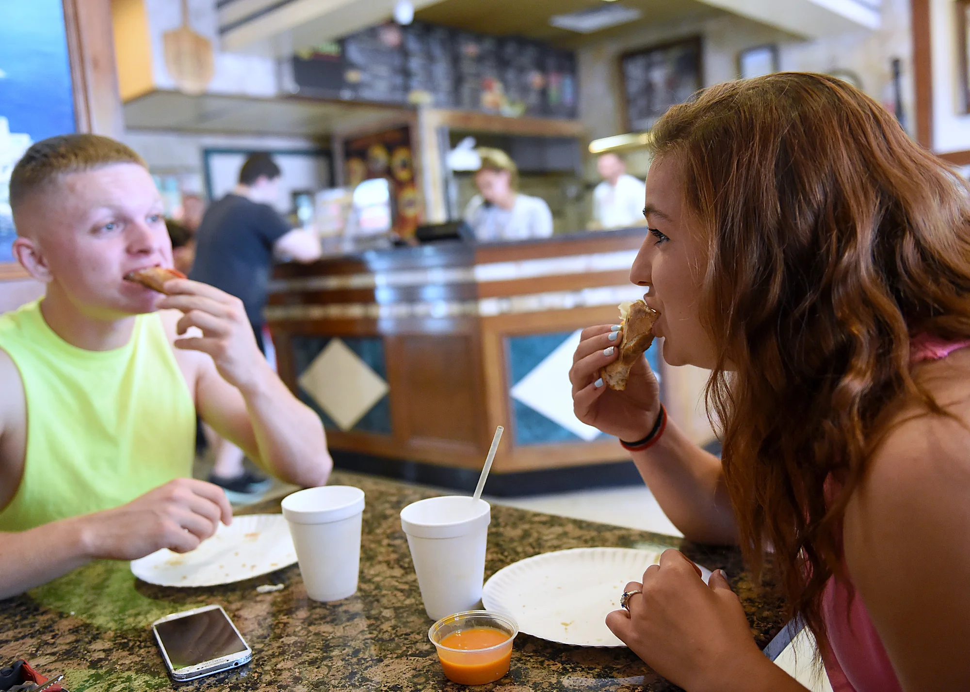  Dee Hubay and fiancé Dan Bryan eat pizza at Adriatic Pizza on New Falls Road in Bristol Township on Tuesday, July 21, 2015 before going to play kickball with family friends. 