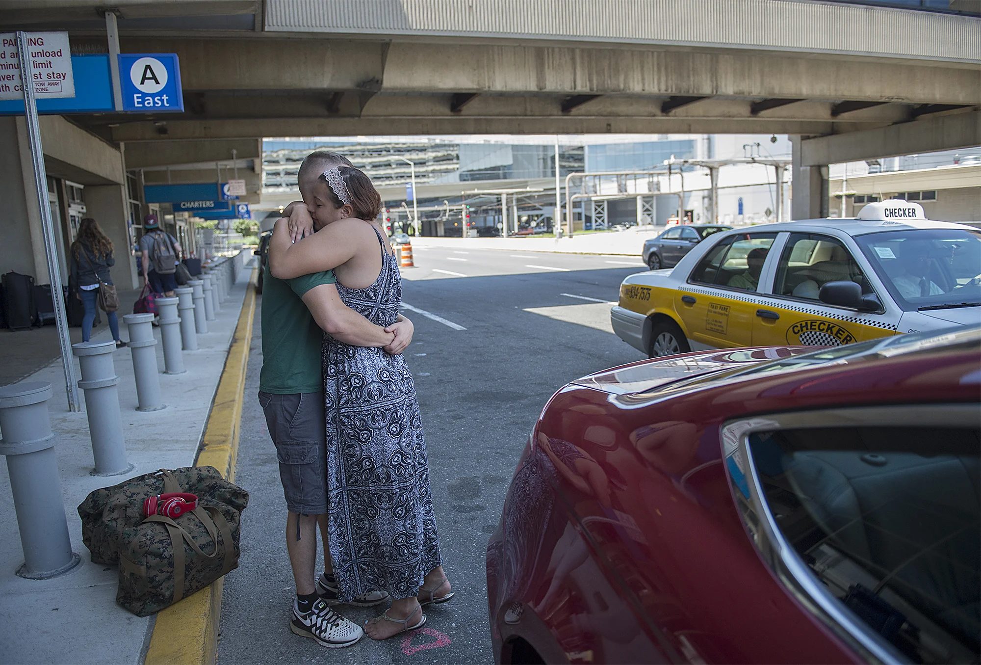 Dee Hubay hugs fiancé Dan Bryan while dropping him off at the Philadelphia International Airport to return to his MOS school on Wednesday, July 22, 2015 after a short break returning to Middletown Township.