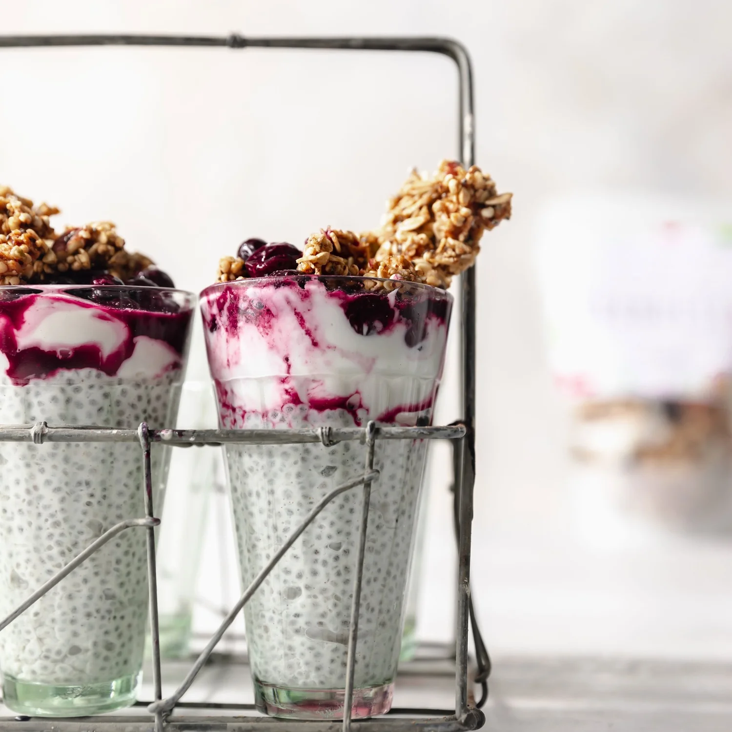 Pumpkin spice chia pudding topped with homemade blueberry syrup and Cranberry Apple Pecan Granuesli.