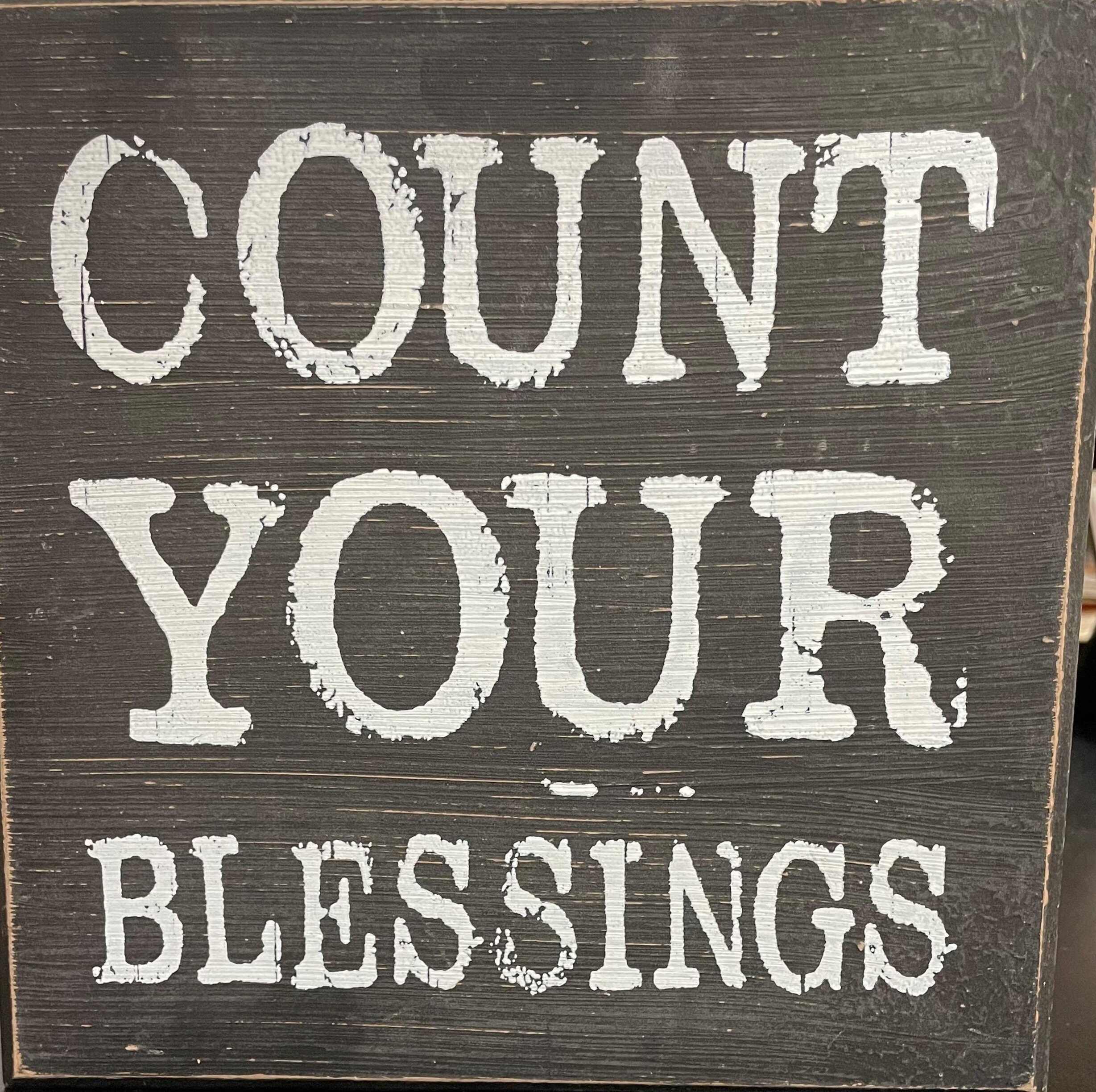 The Count Your Blessings sign on Ms. Lee’s desk