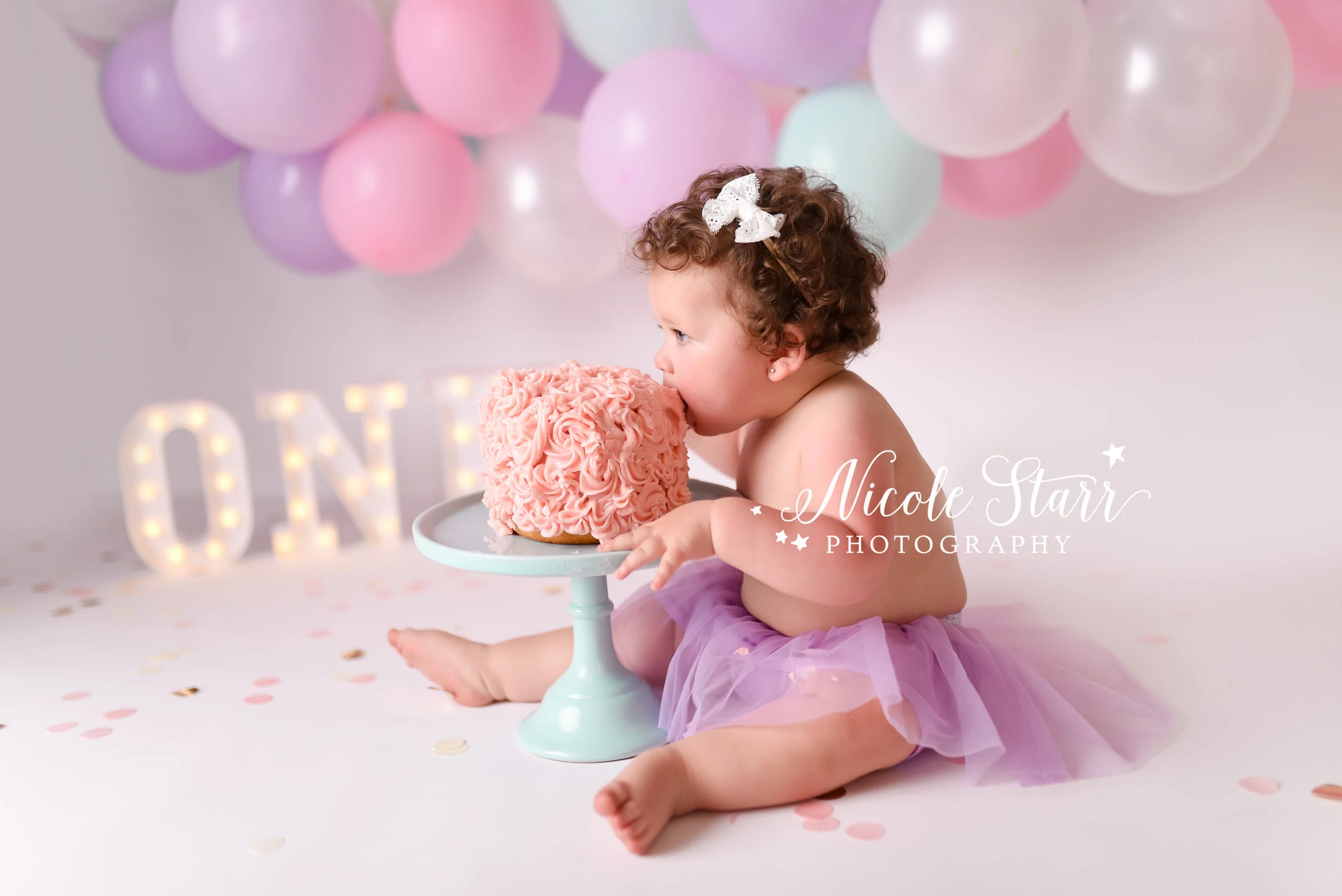 Pastel cake smash with purple, pink, and teal accents by Saratoga Springs NY Cake Smash photographer Nicole Starr Photography | Delmar NY Cake smash, Loudonville NY cake smash, cake smash inspiration