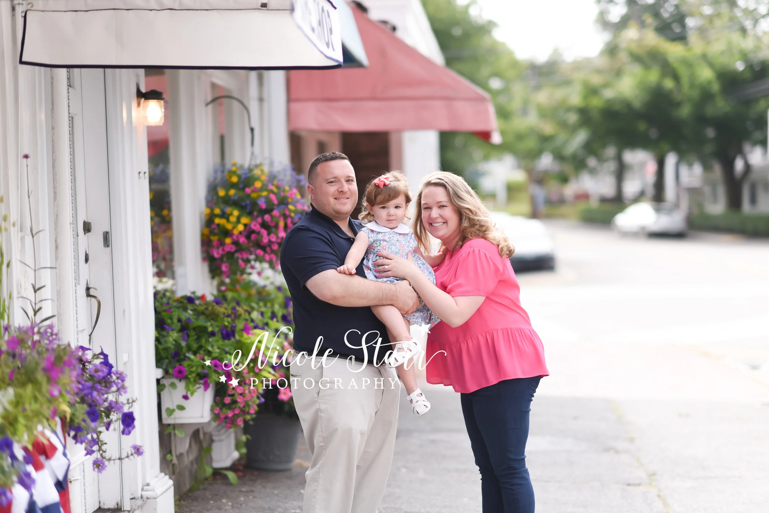 family of three smiles in Cape Cod photographed by Cape Cod family and beach photographer Nicole Starr Photography | Classic Cape Cod portraits