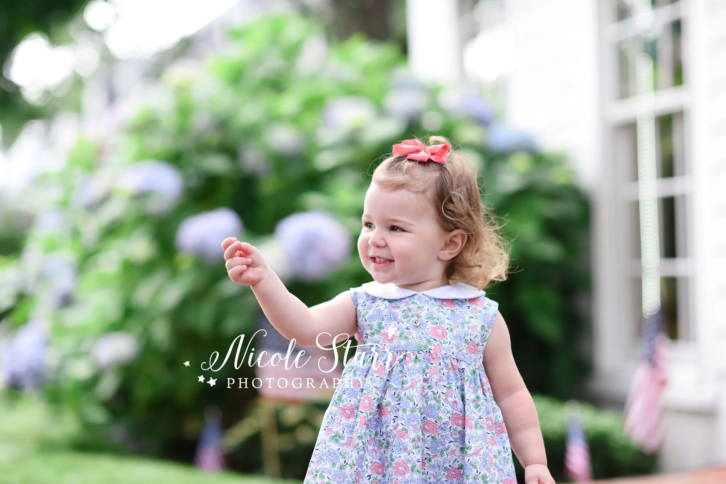 toddler plays near shops in Chatham photographed by Cape Cod family and beach photographer Nicole Starr Photography | Classic Cape Cod portraits