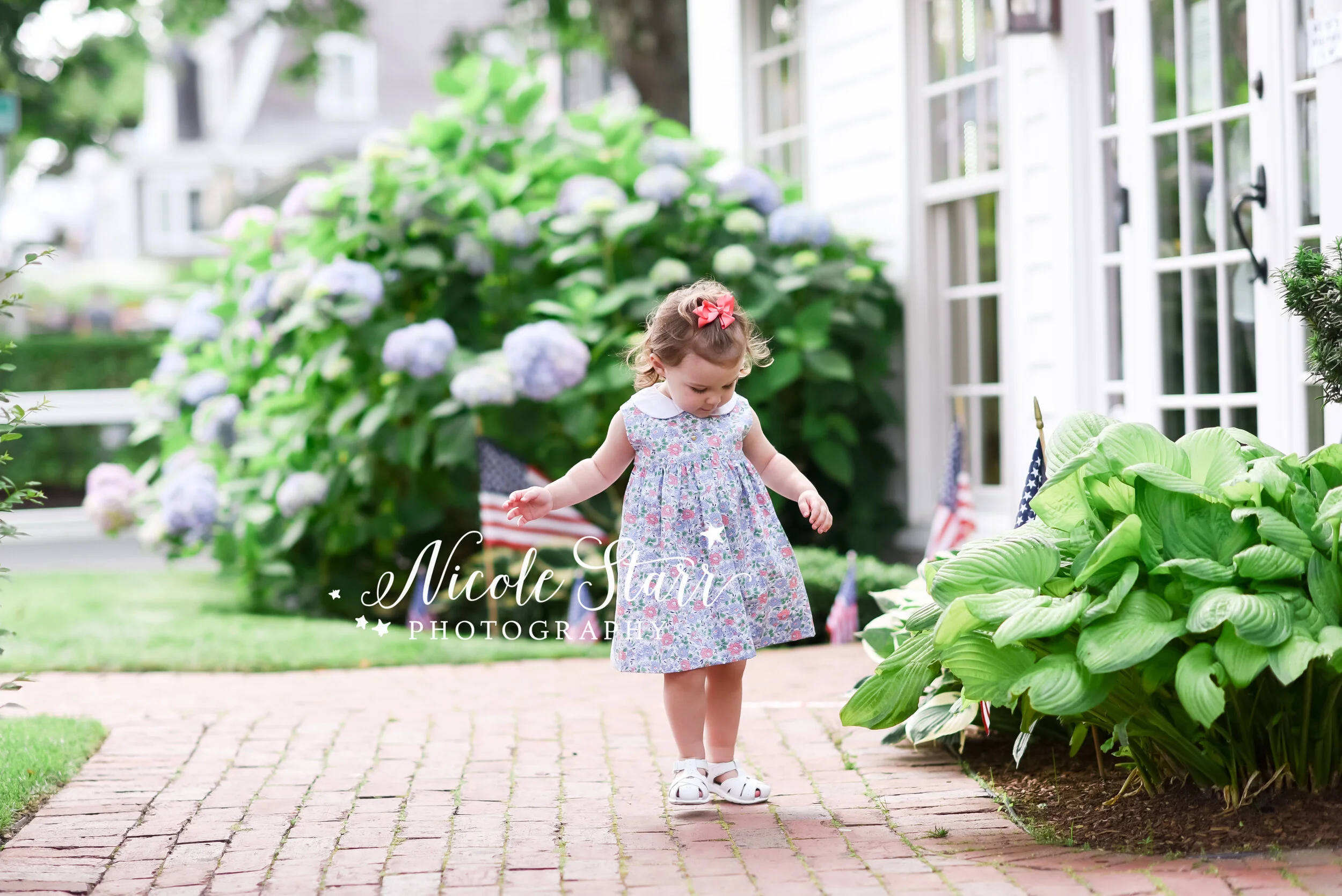 playful Downtown Chatham portraits with toddler and family photographed by Cape Cod family and beach photographer Nicole Starr Photography | Classic Cape Cod portraits