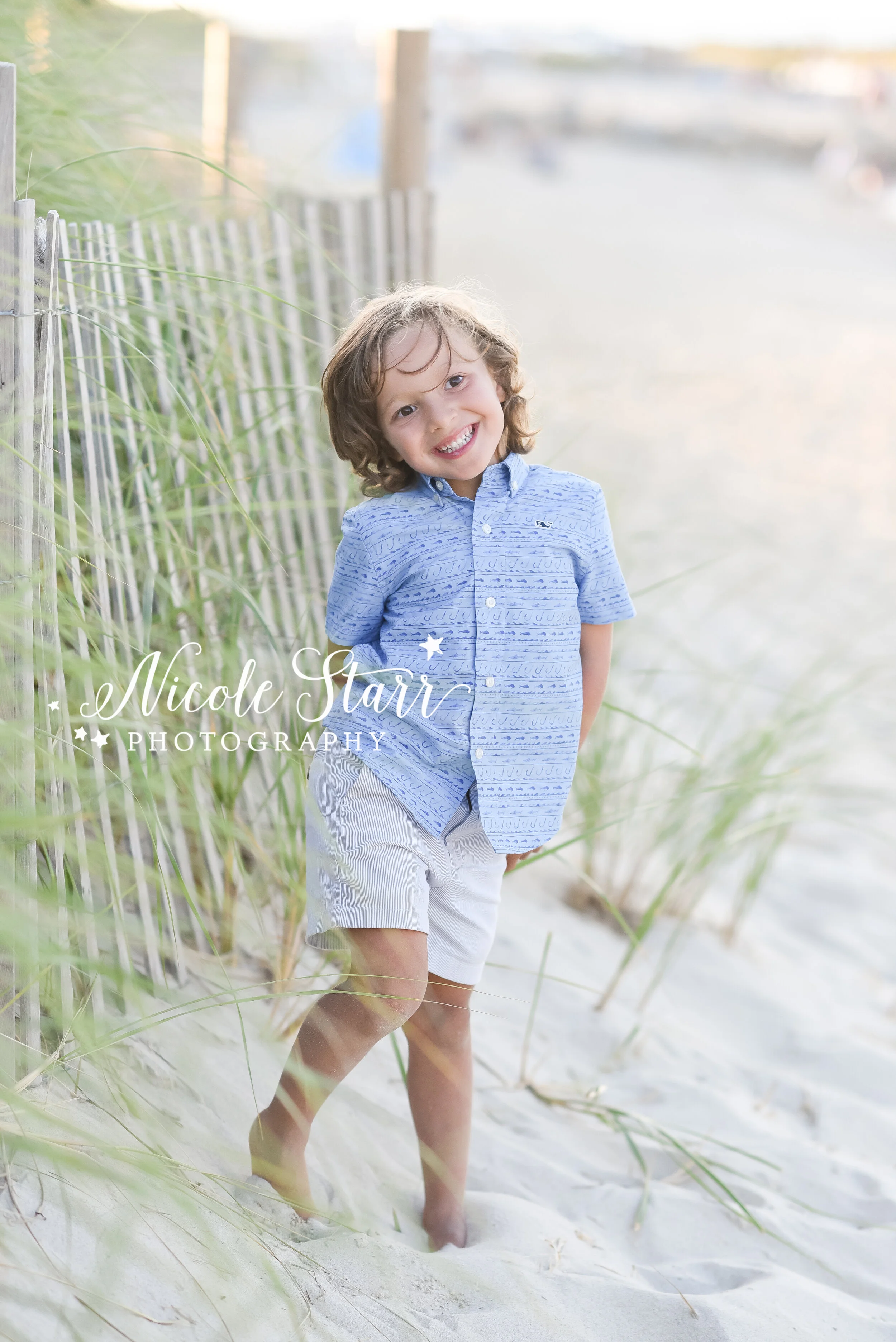 son playfully poses during Corporation Beach family session photographed by Cape Cod family photographer Nicole Starr Photography