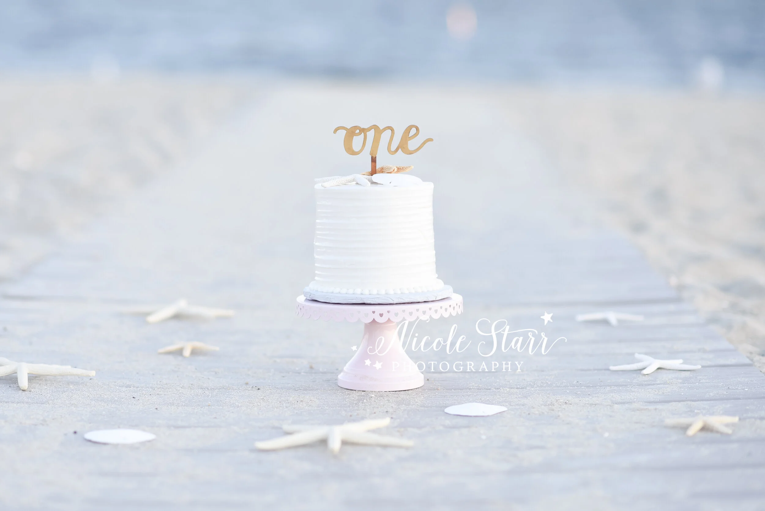 Beach cake smash session in Cape Cod with Cape Cod family and cake smash photographer Nicole Starr Photography